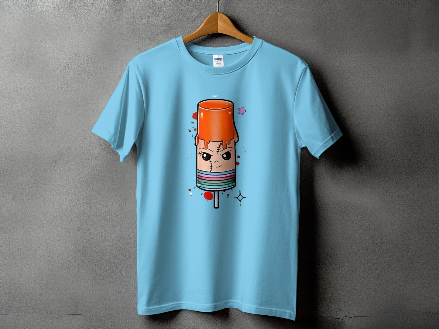 Light blue t-shirt with a cartoon popsicle monster graphic.