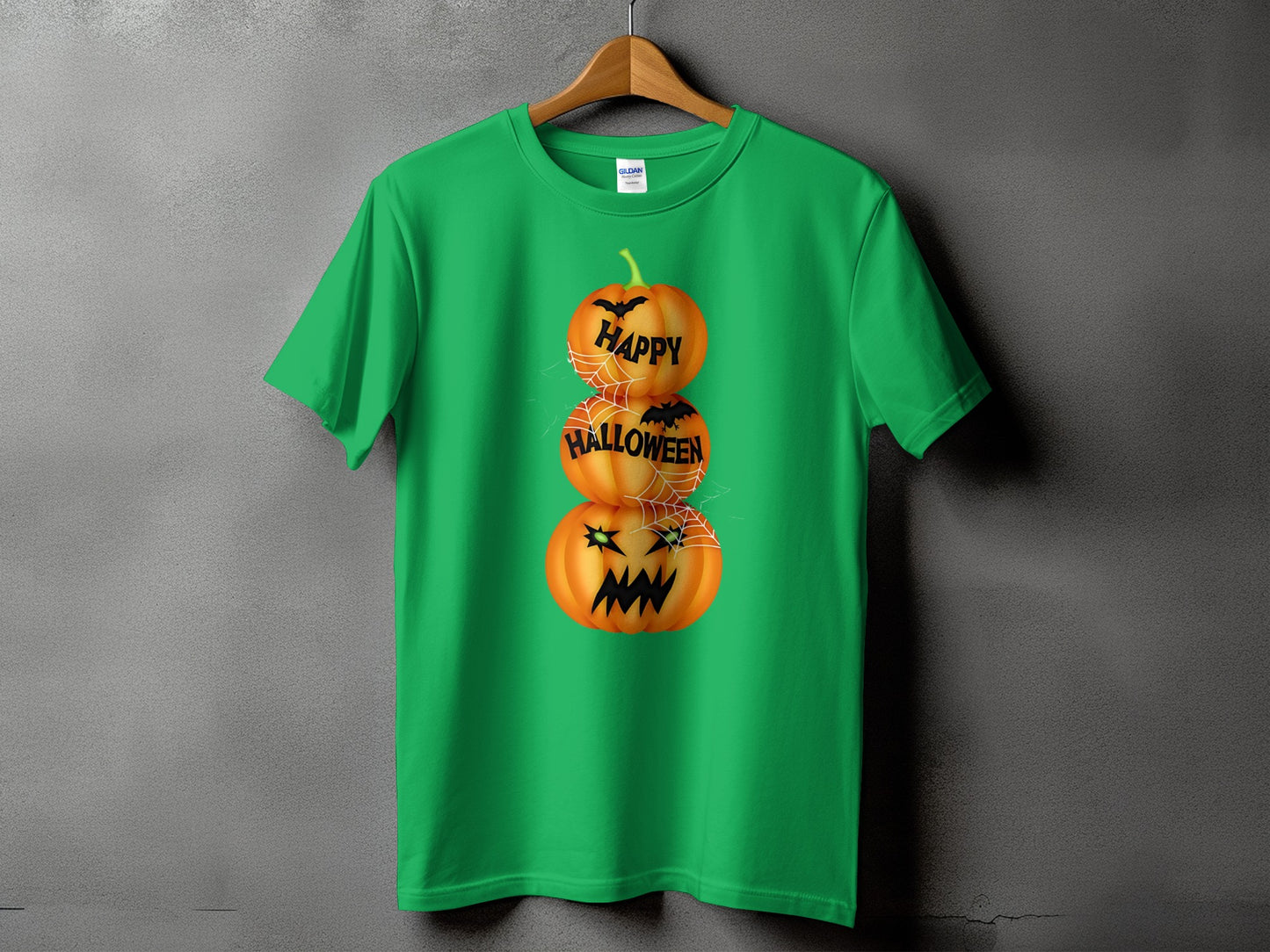 Green t-shirt with stacked pumpkins graphic and text "Happy Halloween".