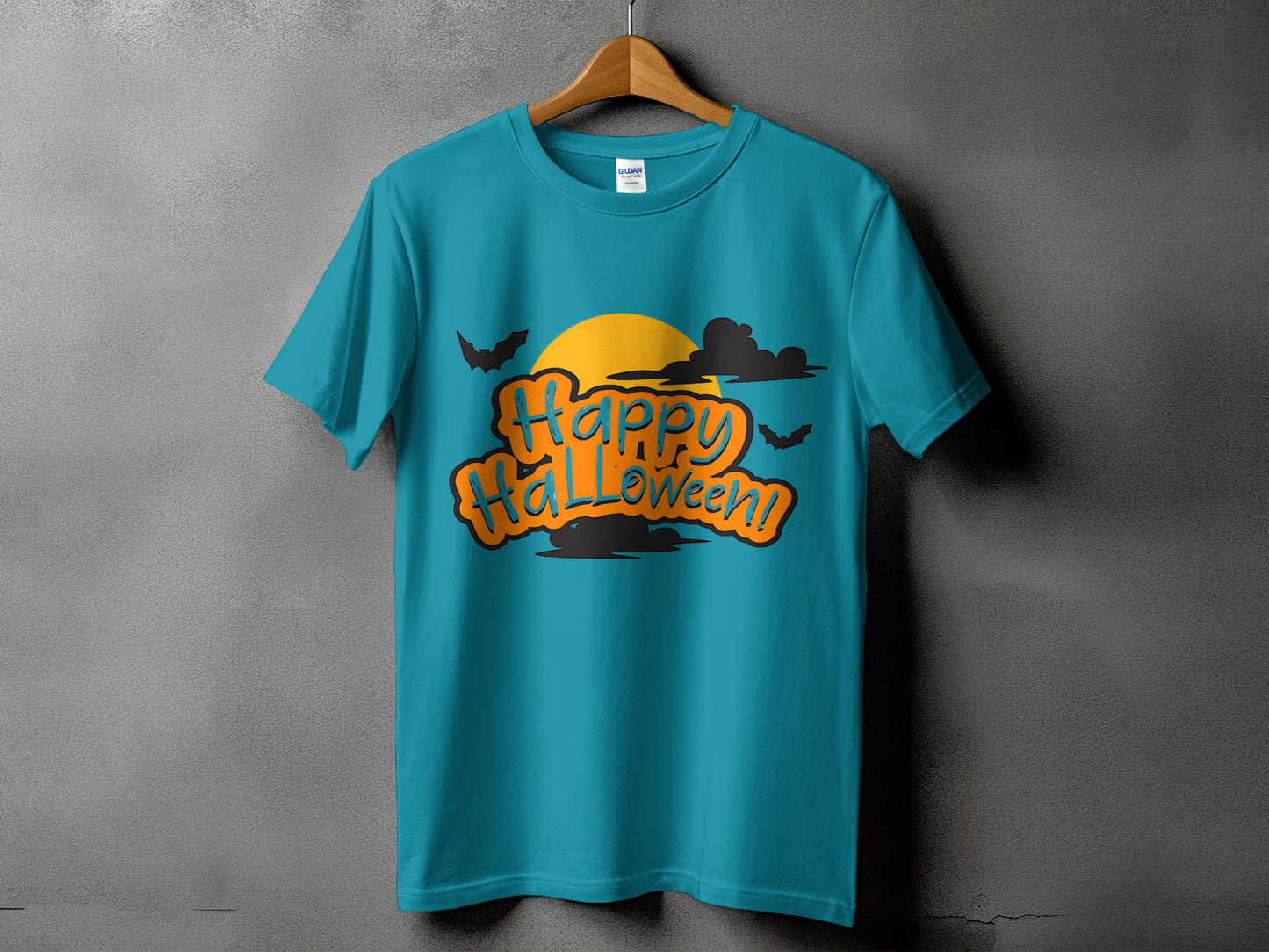 Teal t-shirt with "Happy Halloween!" text, moon, clouds, and bats graphic.
