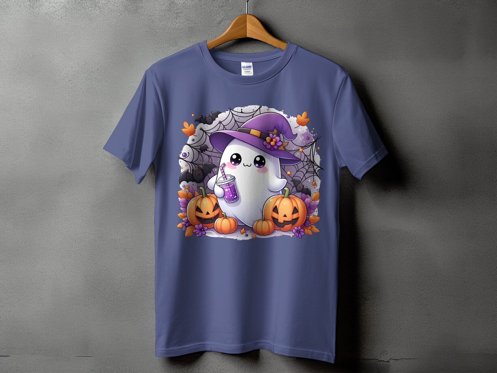 Cute ghost in witch hat with pumpkins, bats, and spiderwebs on a purple t-shirt.
