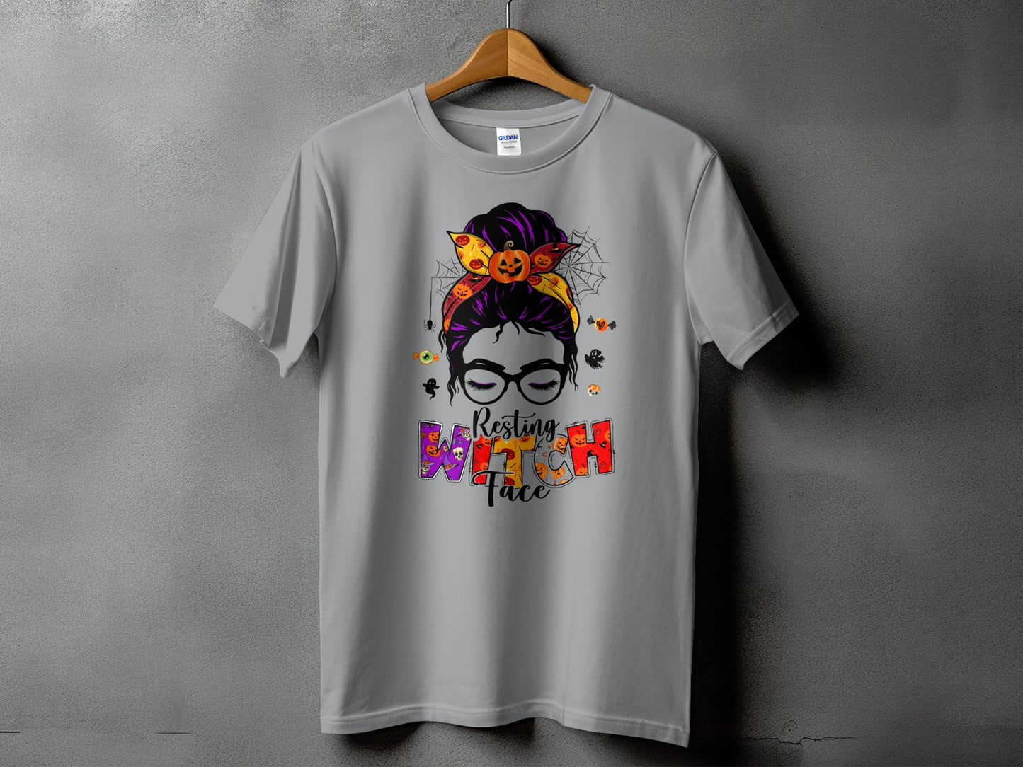 Gray t-shirt with Halloween graphic of a messy bun, glasses, and text "Resting Witch Face".