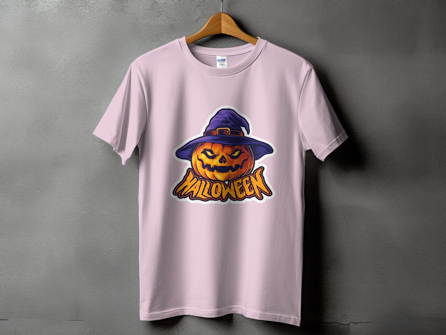 Pink t-shirt with a Halloween pumpkin wearing a witch hat and the word "Halloween".