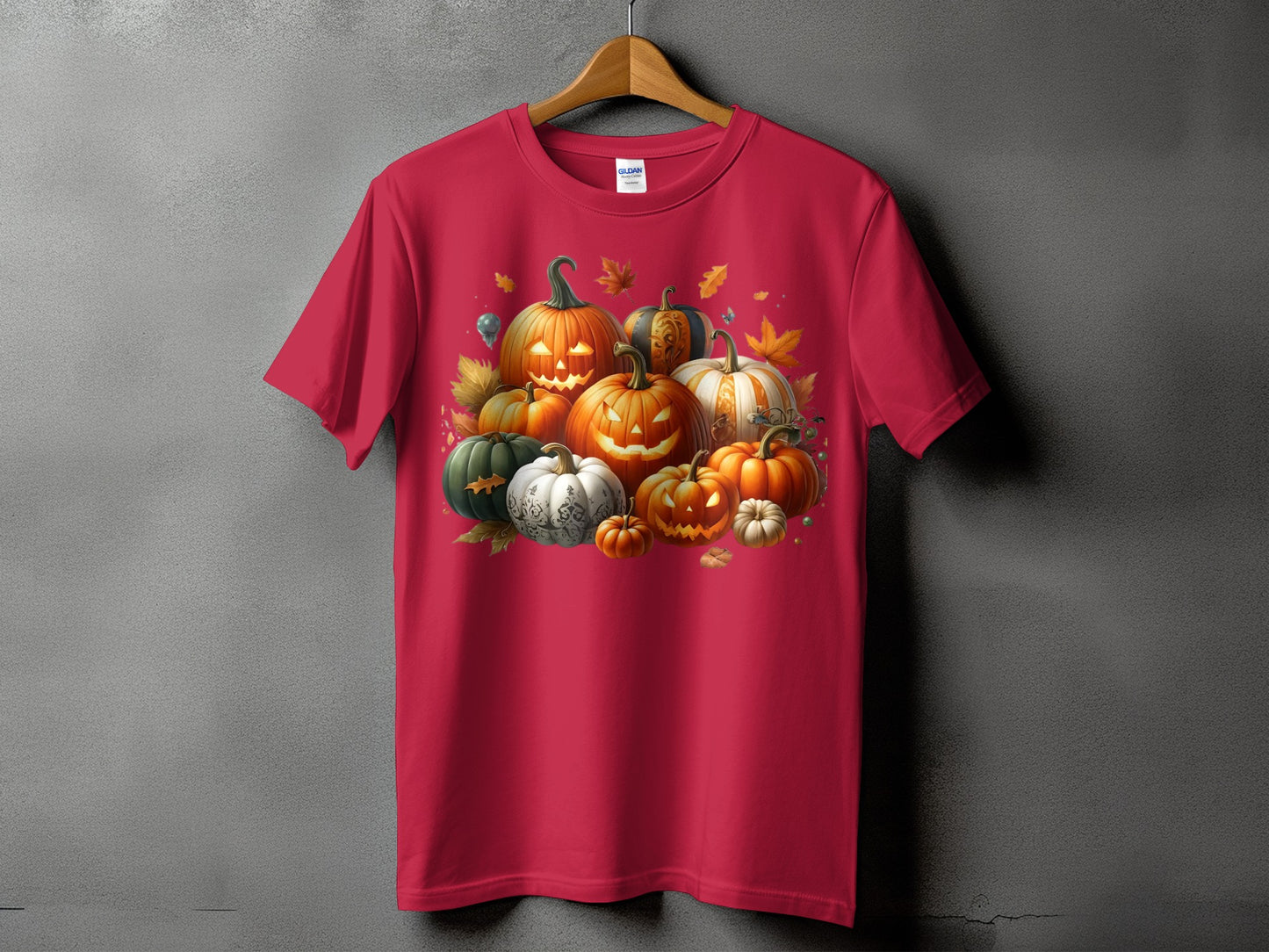 Red t-shirt with a graphic of various carved and decorated pumpkins for Halloween.
