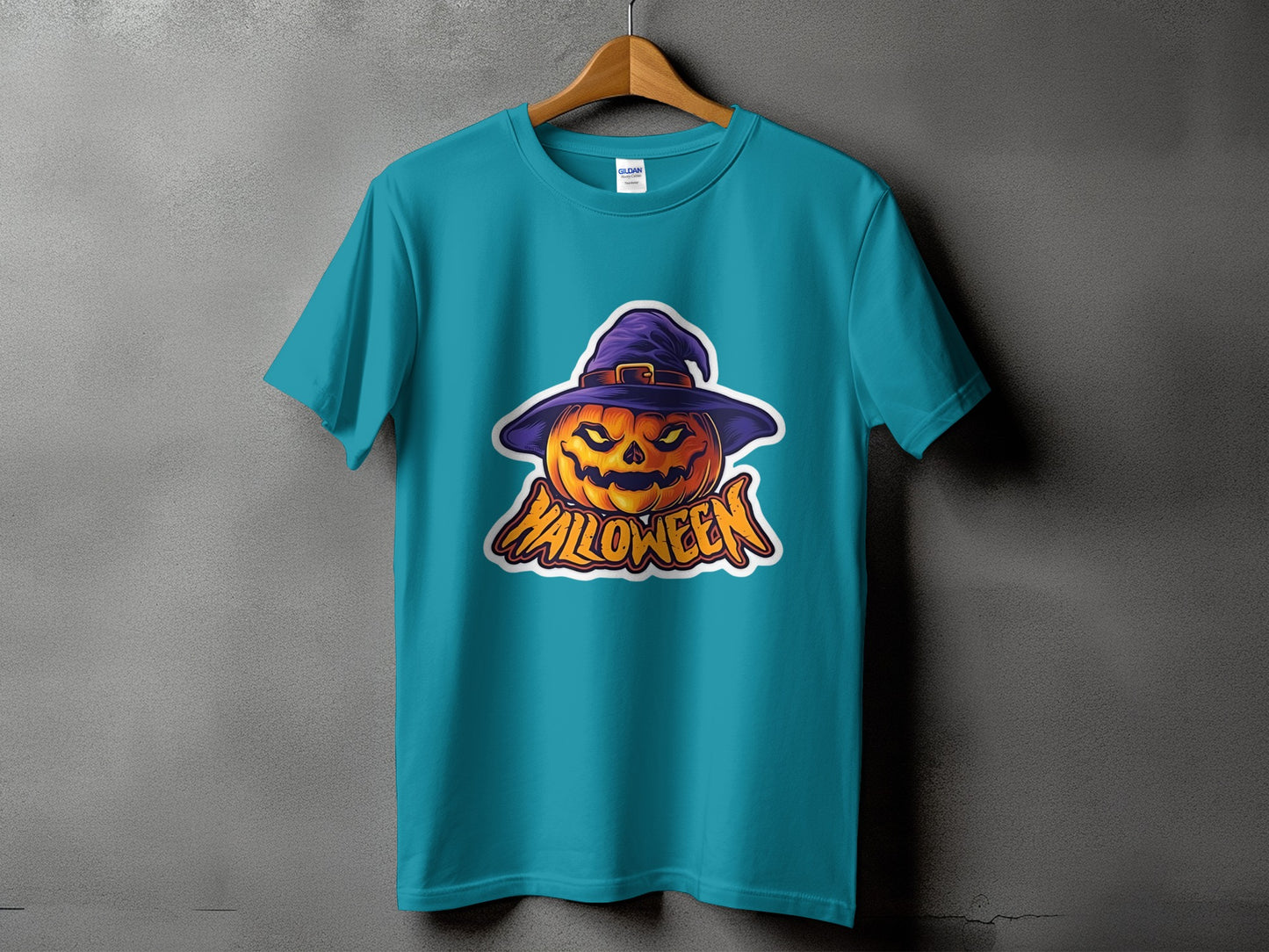 Teal t-shirt with a cartoon jack-o'-lantern wearing a purple hat and the word "Halloween".