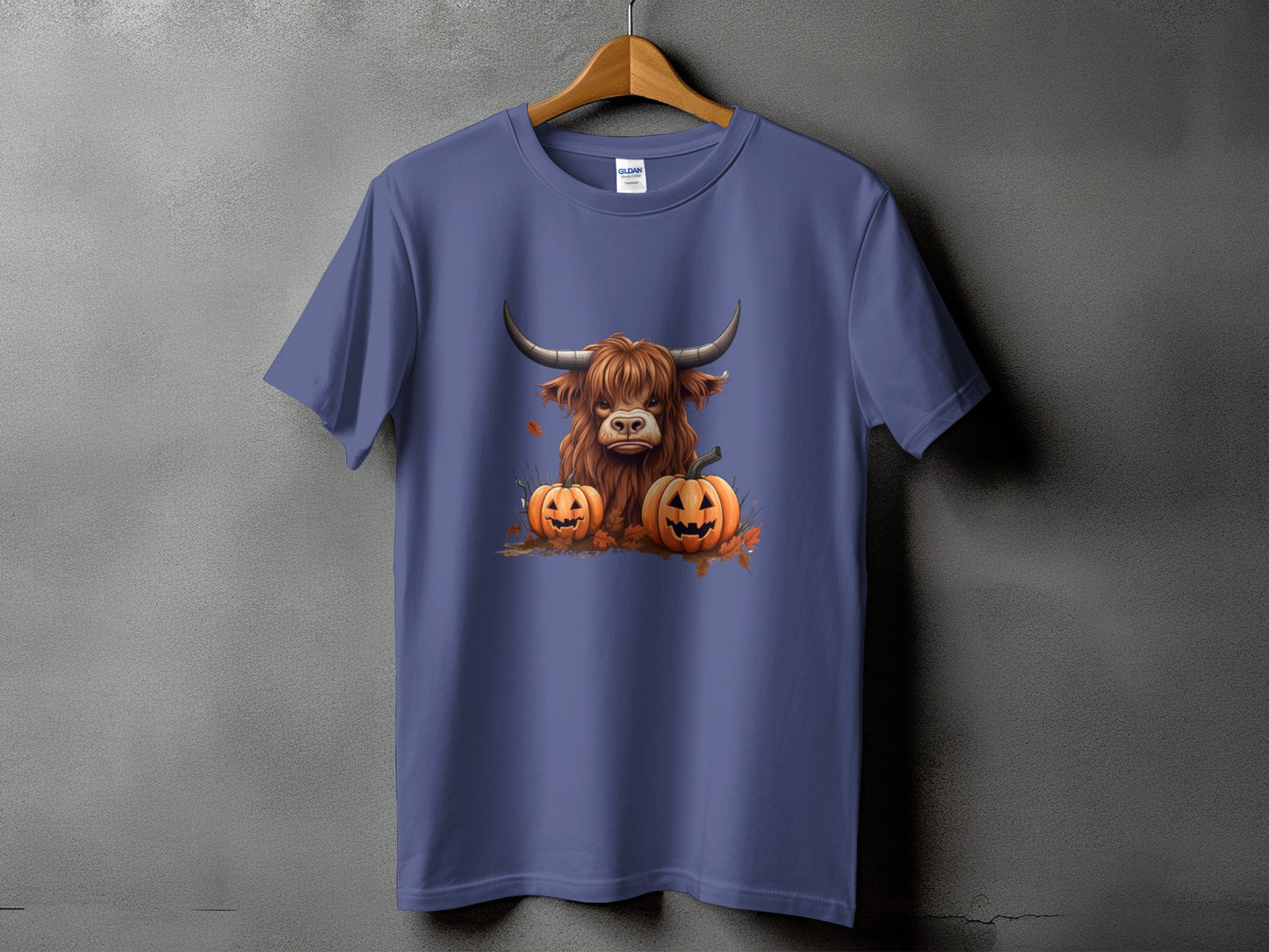 Purple t-shirt with a Highland cow and two jack-o'-lanterns graphic.