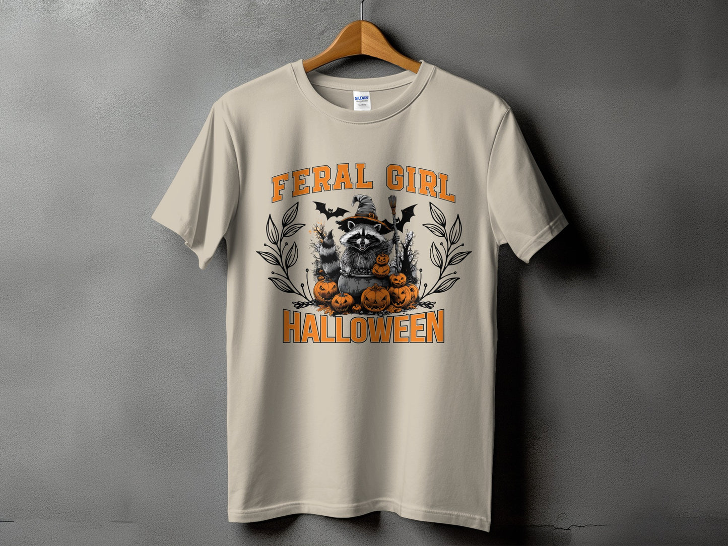 T-shirt with raccoon, pumpkins, bats, and text "FERAL GIRL HALLOWEEN."