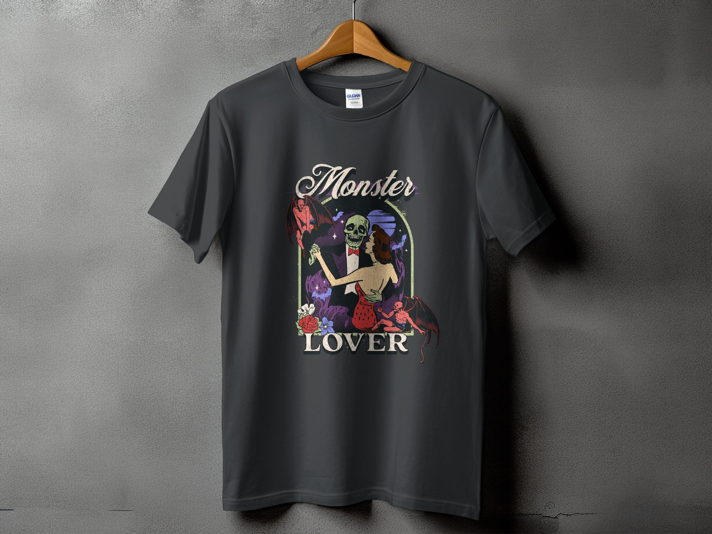 Dark t-shirt with a graphic featuring the text "Monster Lover" and gothic-themed art.