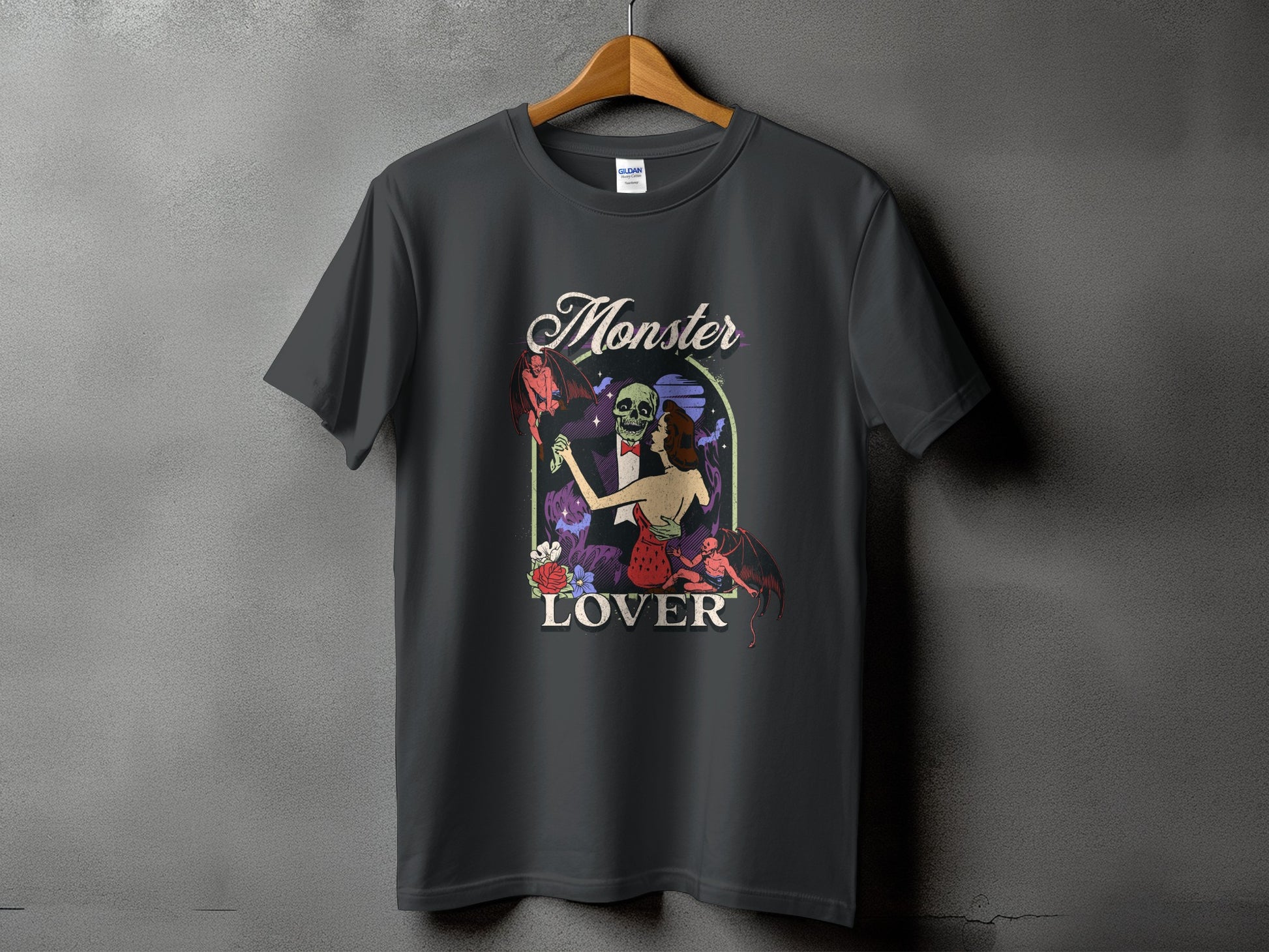 Dark t-shirt with a graphic featuring the text "Monster Lover" and gothic-themed art.