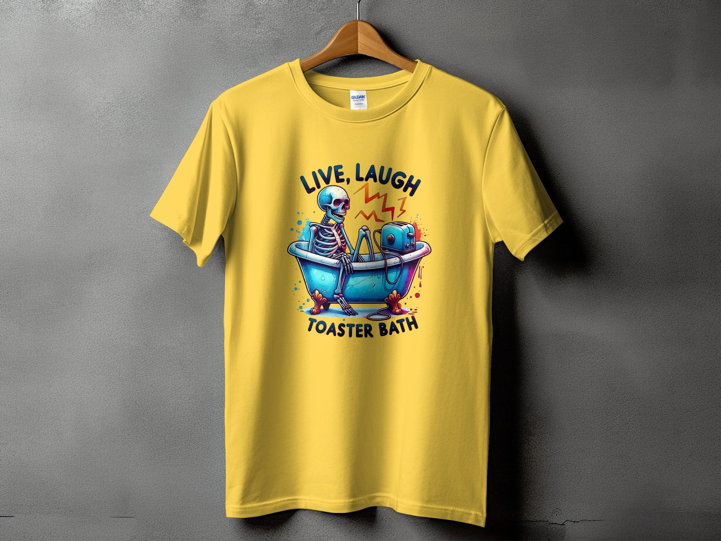 Yellow t-shirt with skeleton in bathtub and toaster, text "LIVE, LAUGH, TOASTER BATH".