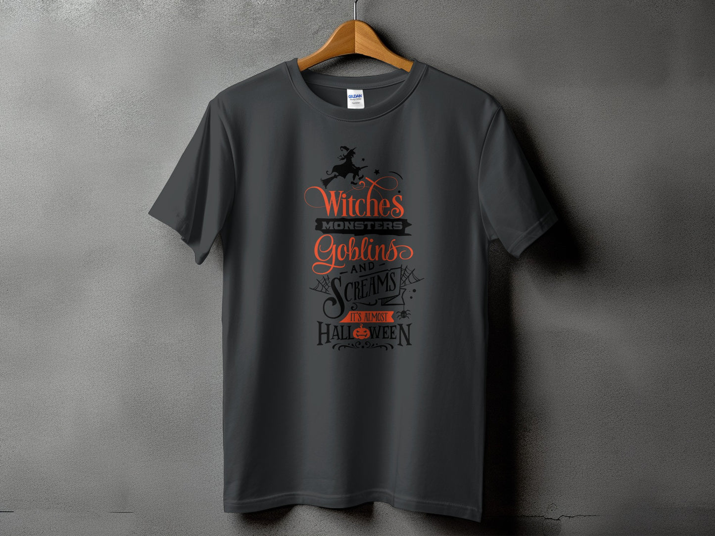 Dark grey t-shirt with text: Witches, Monsters, Goblins, and Screams. It's Almost Halloween.