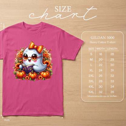 Pink t-shirt with a cute ghost reading a book, surrounded by pumpkins and flowers.