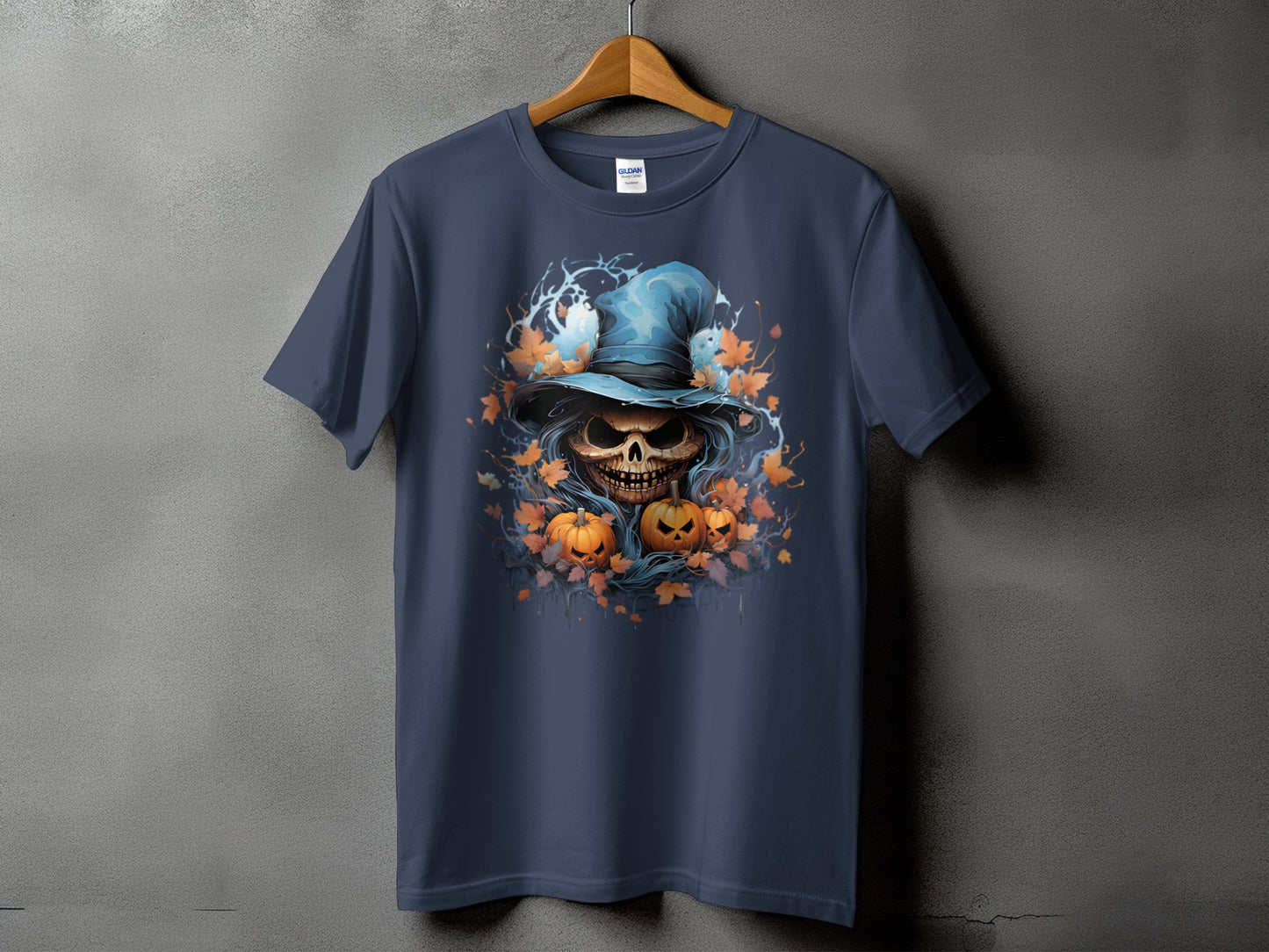 Dark blue t-shirt with a grinning skull wearing a witch hat and pumpkins.