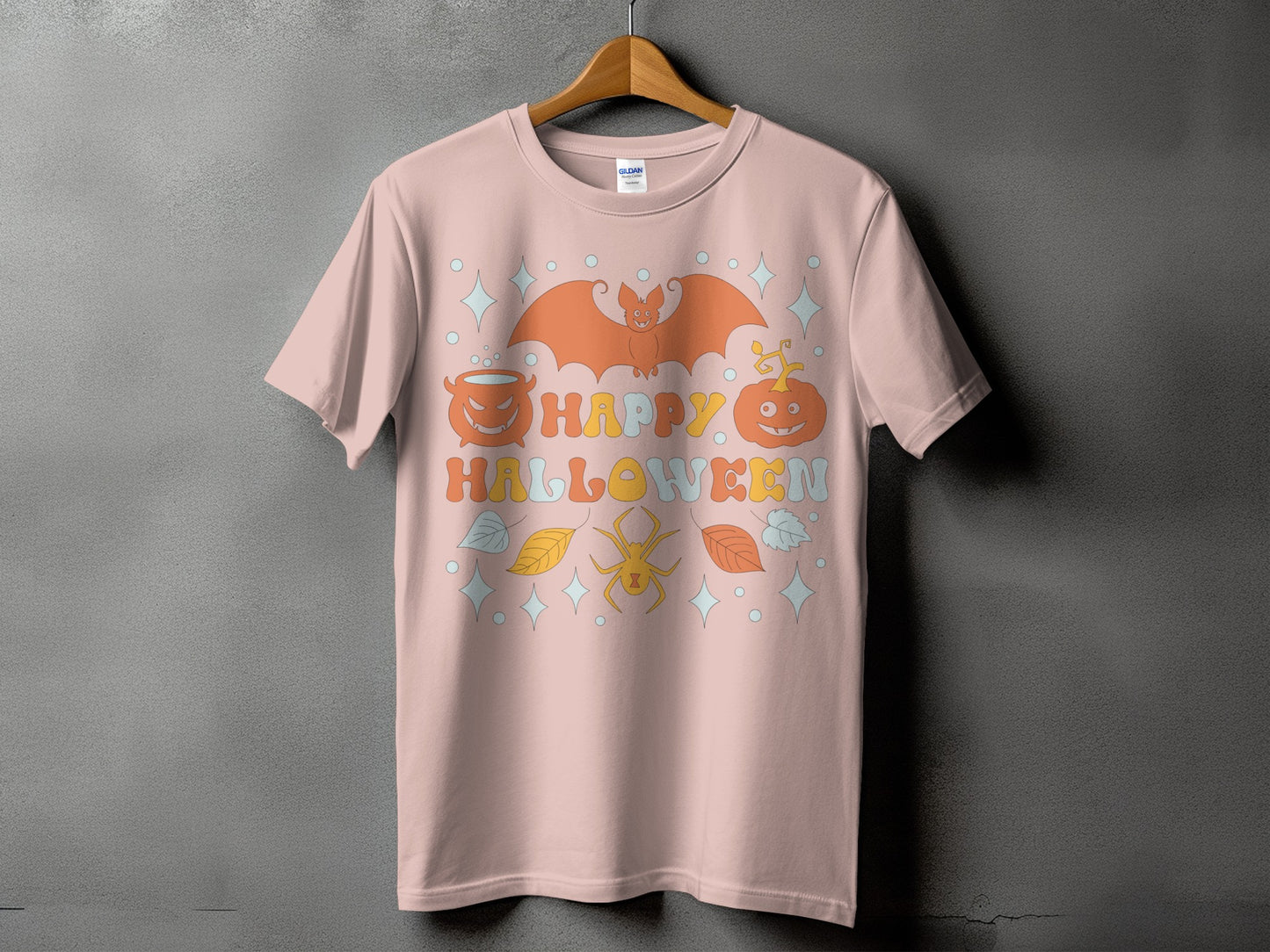 Pink t-shirt with "Happy Halloween" text and retro Halloween graphics.