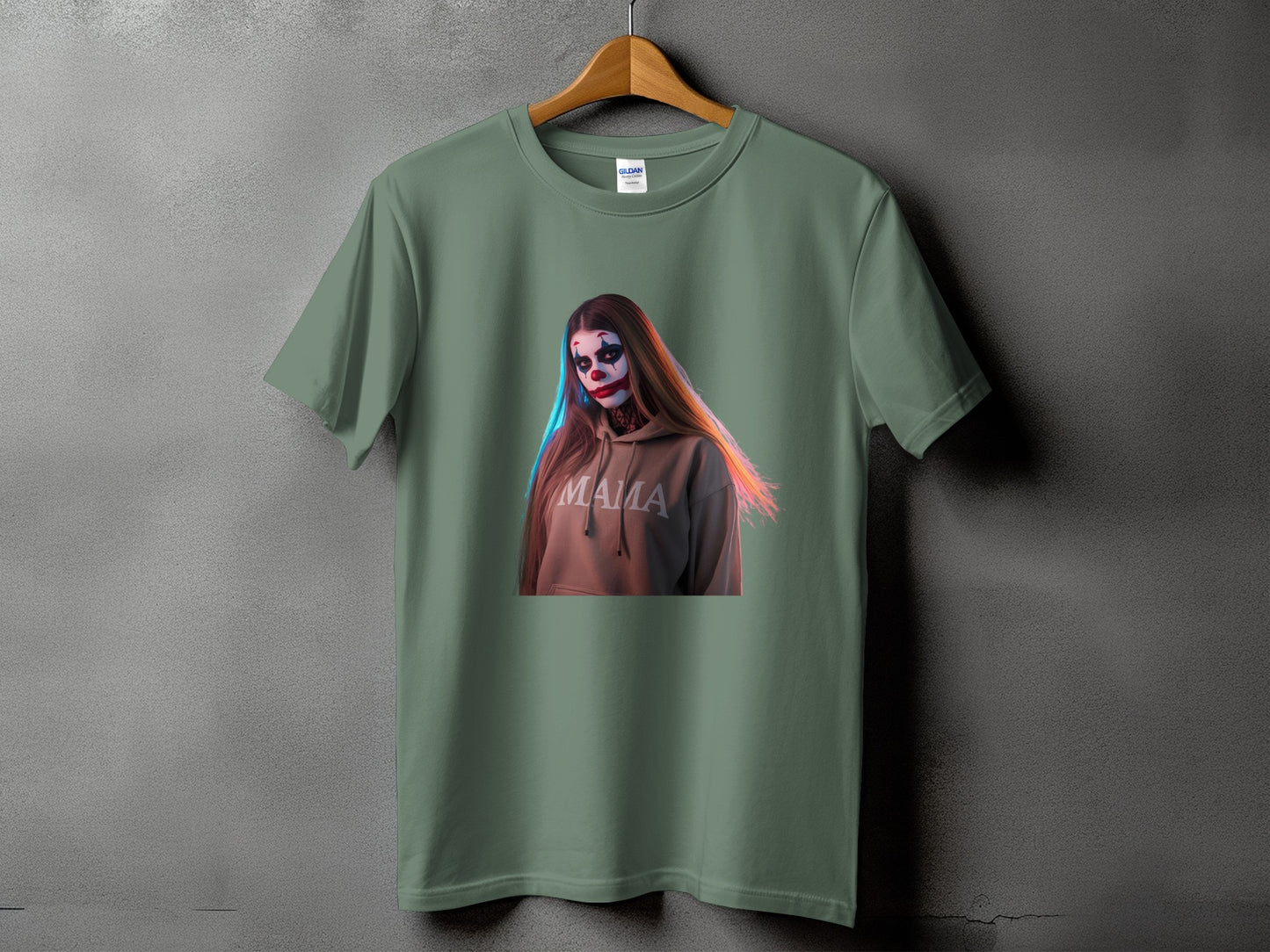 Olive green t-shirt with a graphic of a woman with clown makeup and the word "MAMA" on it.