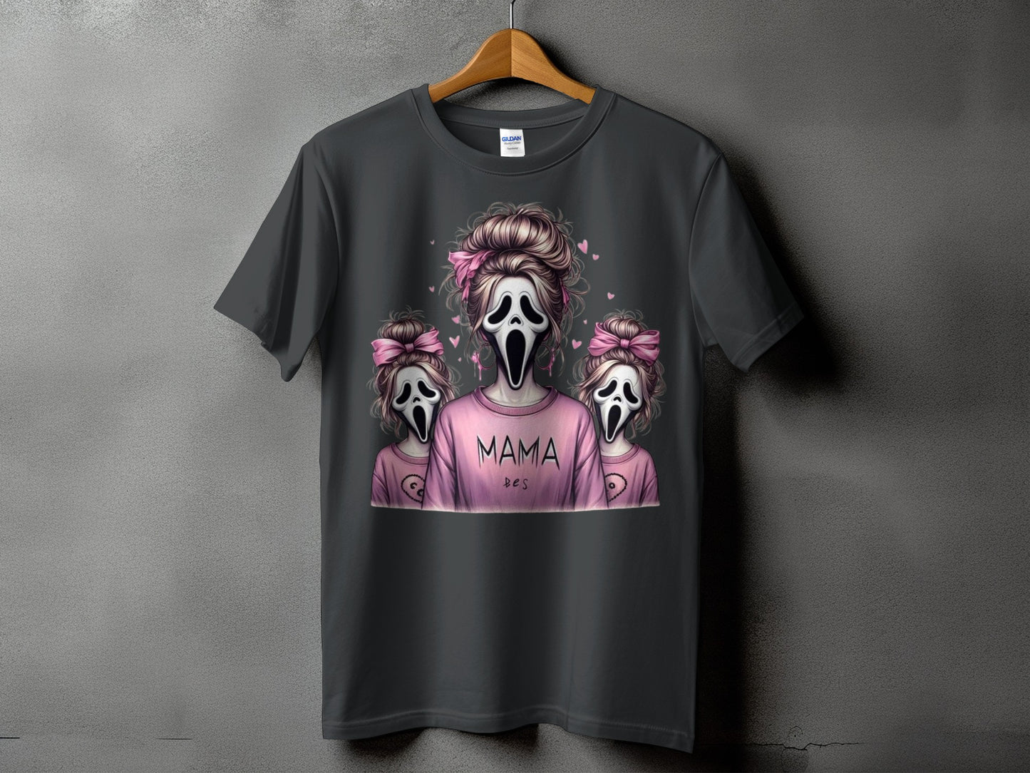 Dark t-shirt with "Mama" and two ghost figures with pink bows.