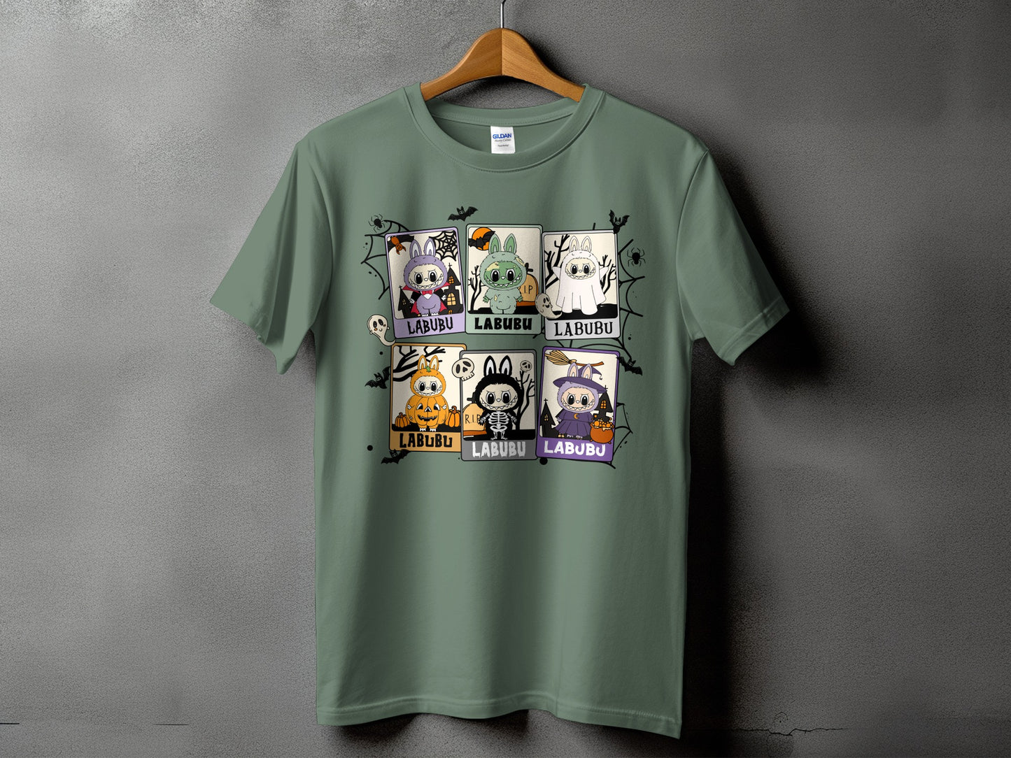 Green t-shirt with a Halloween-themed grid of Labubu characters in costumes.