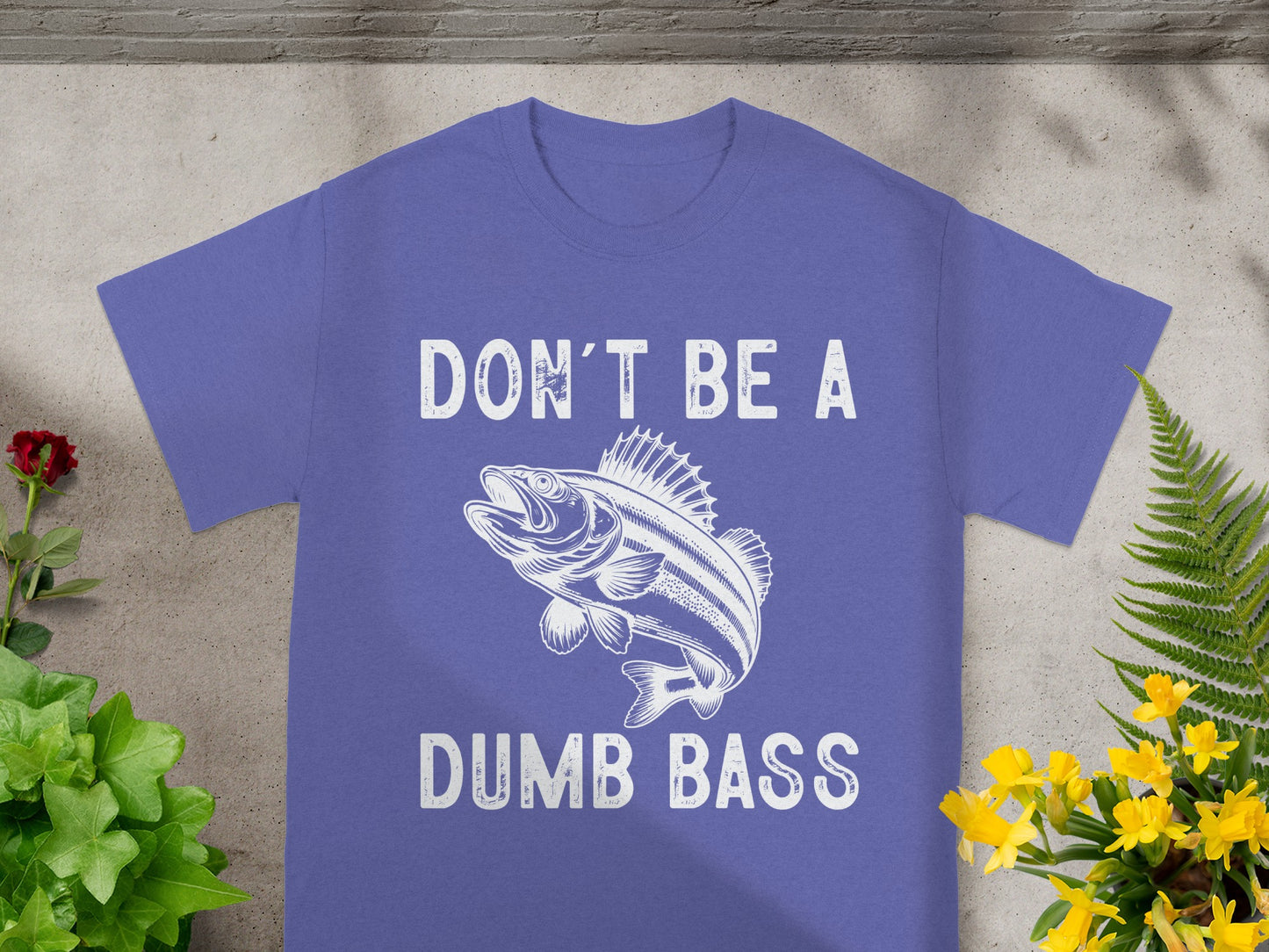 Purple t-shirt with white graphic and text "DON'T BE A DUMB BASS".
