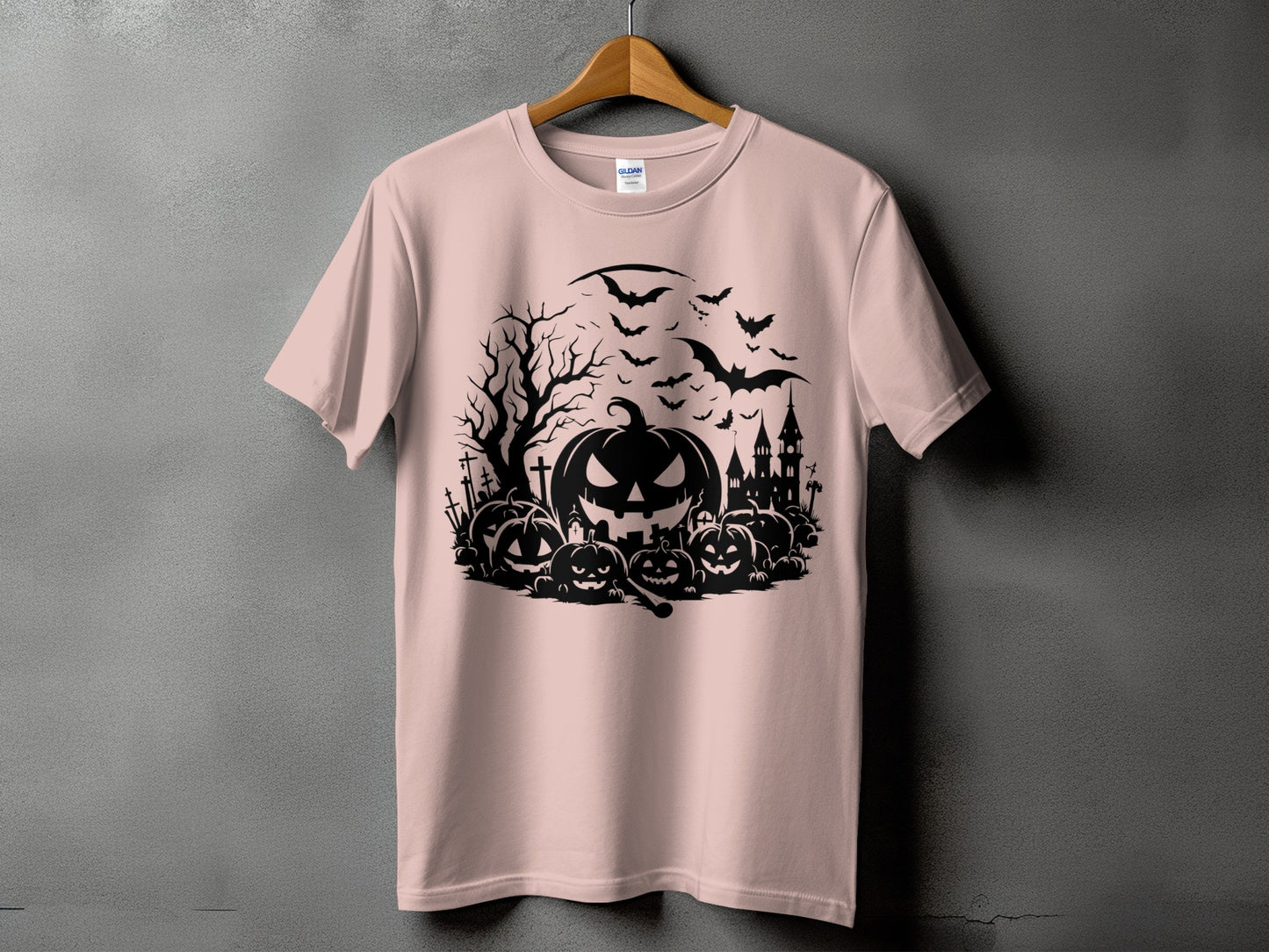 Halloween t-shirt with black pumpkins, bats, spooky tree, and castle graphic.