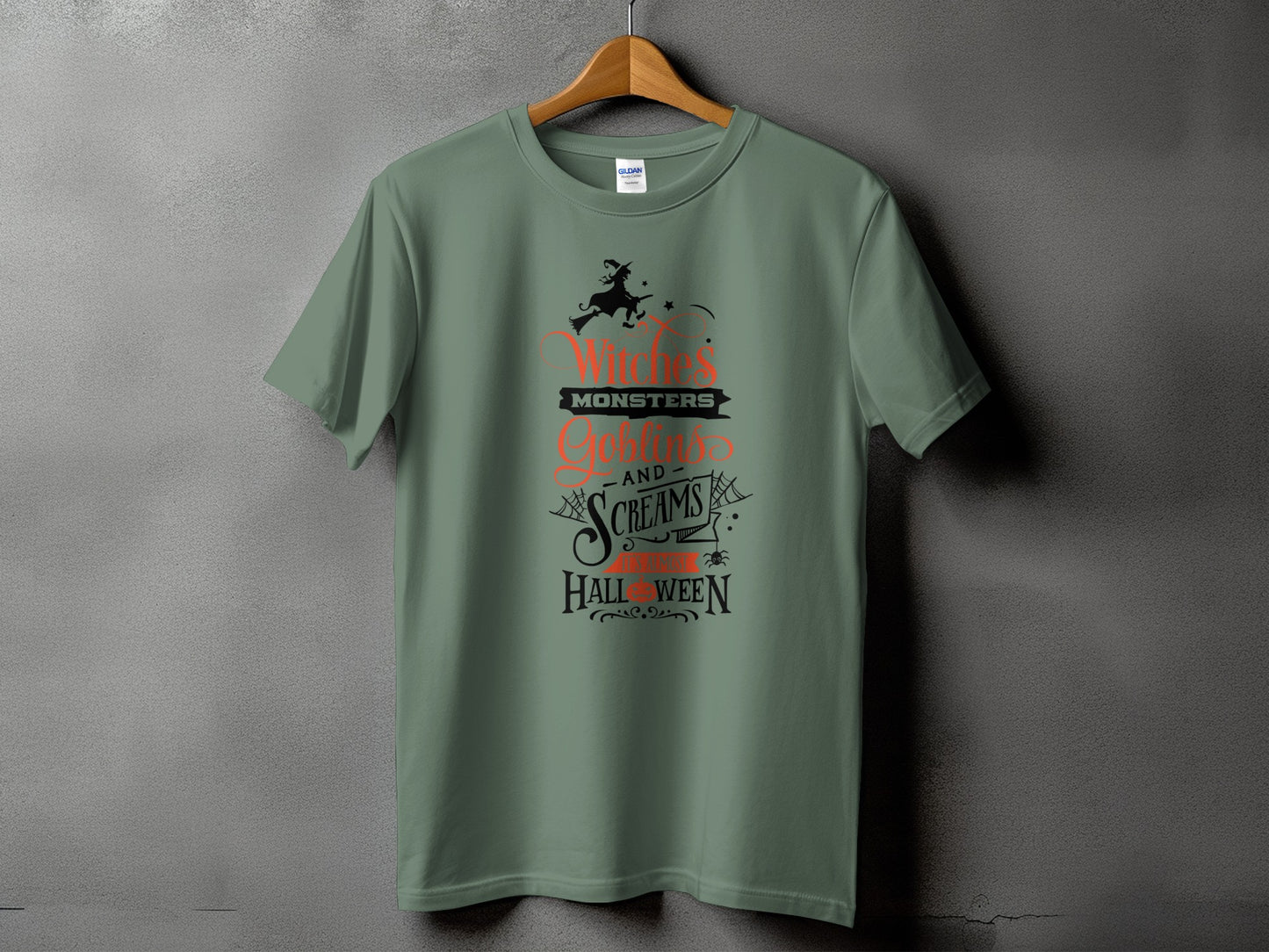 Green t-shirt with Halloween text and graphic: "Witches' Monsters, Goblins' Screams and Spooky Halloween."
