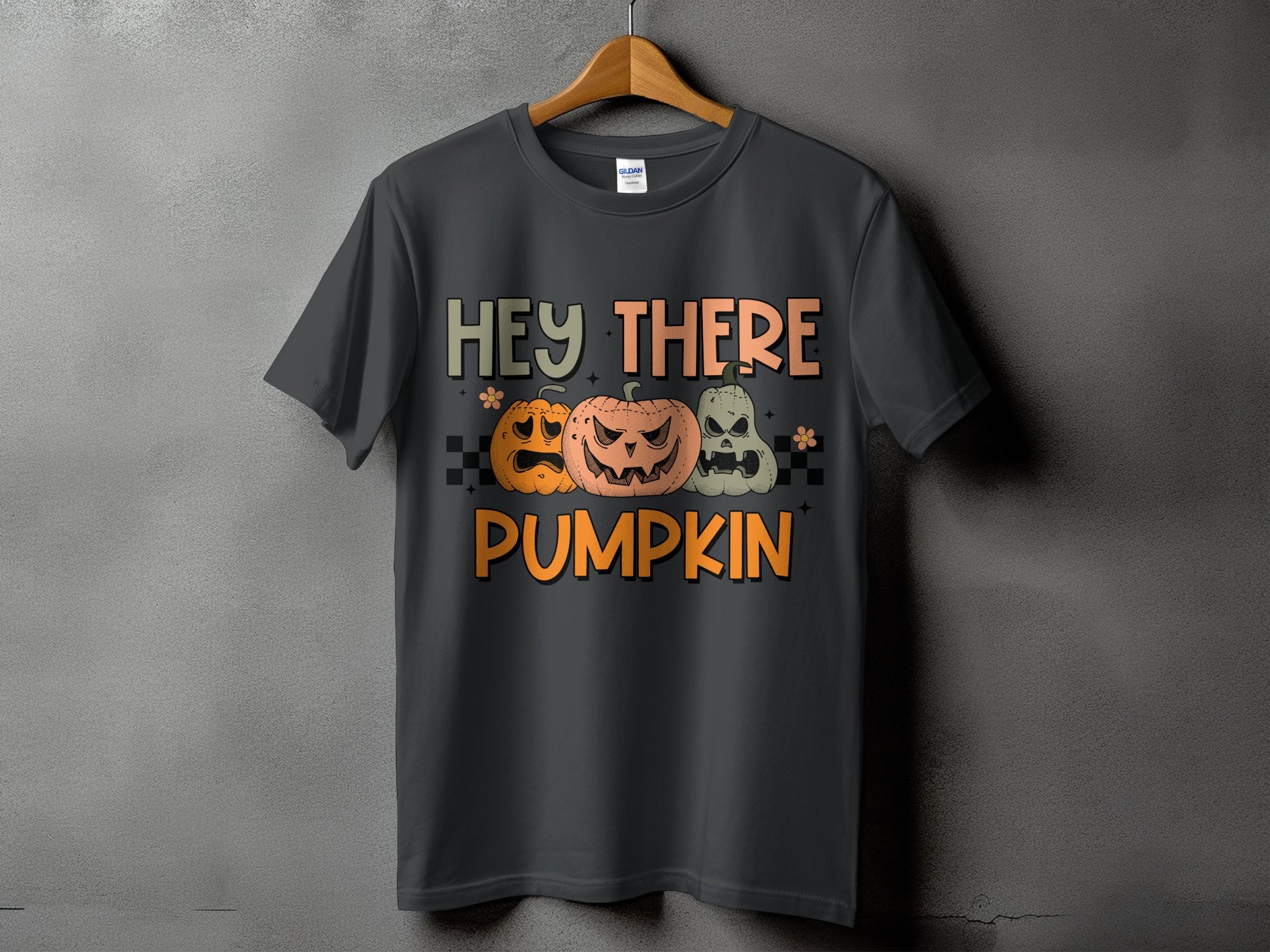 Dark gray t-shirt with Halloween pumpkins and text "Hey There Pumpkin".