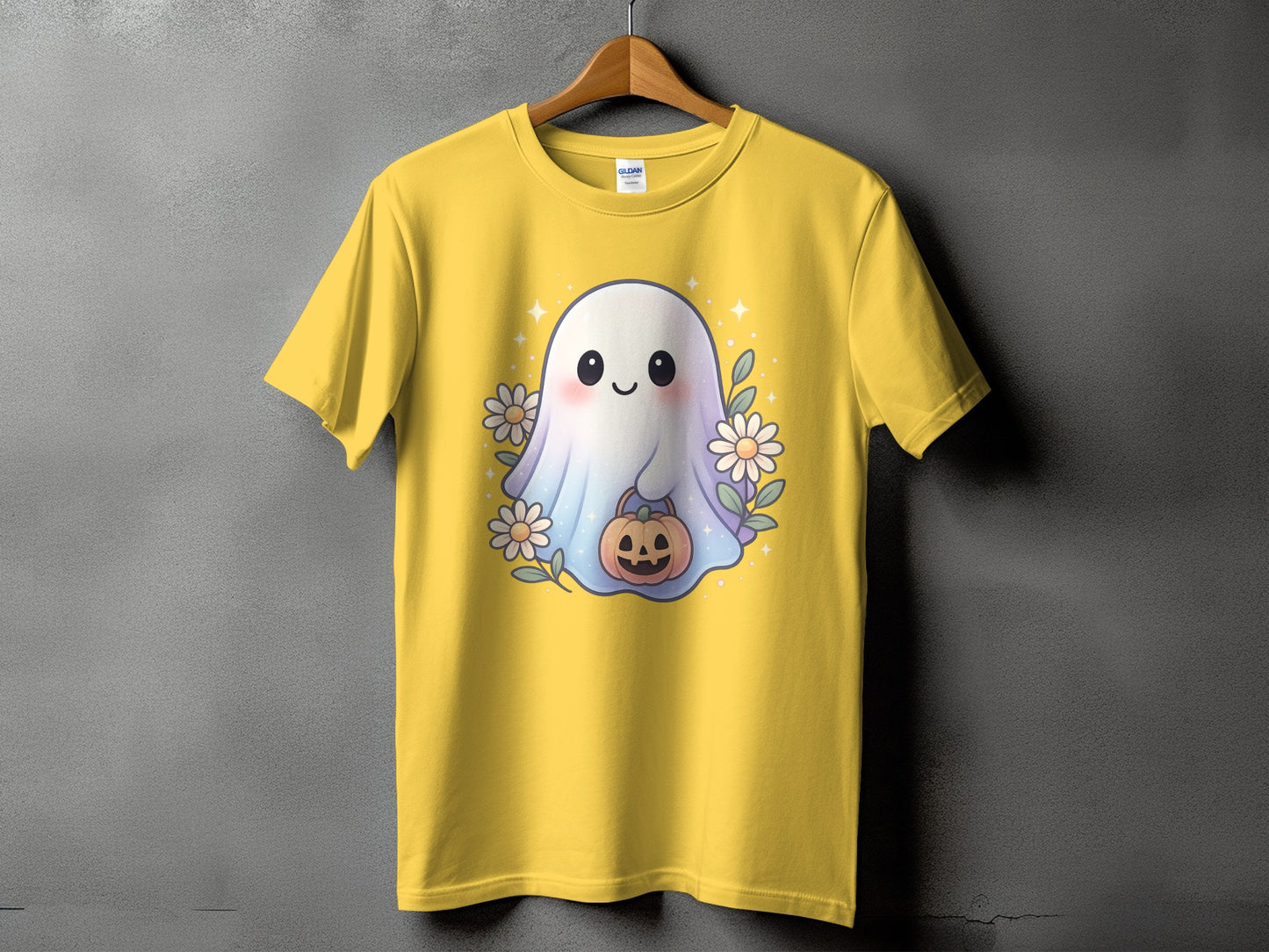 Yellow t-shirt with a cute ghost holding a pumpkin and surrounded by flowers.
