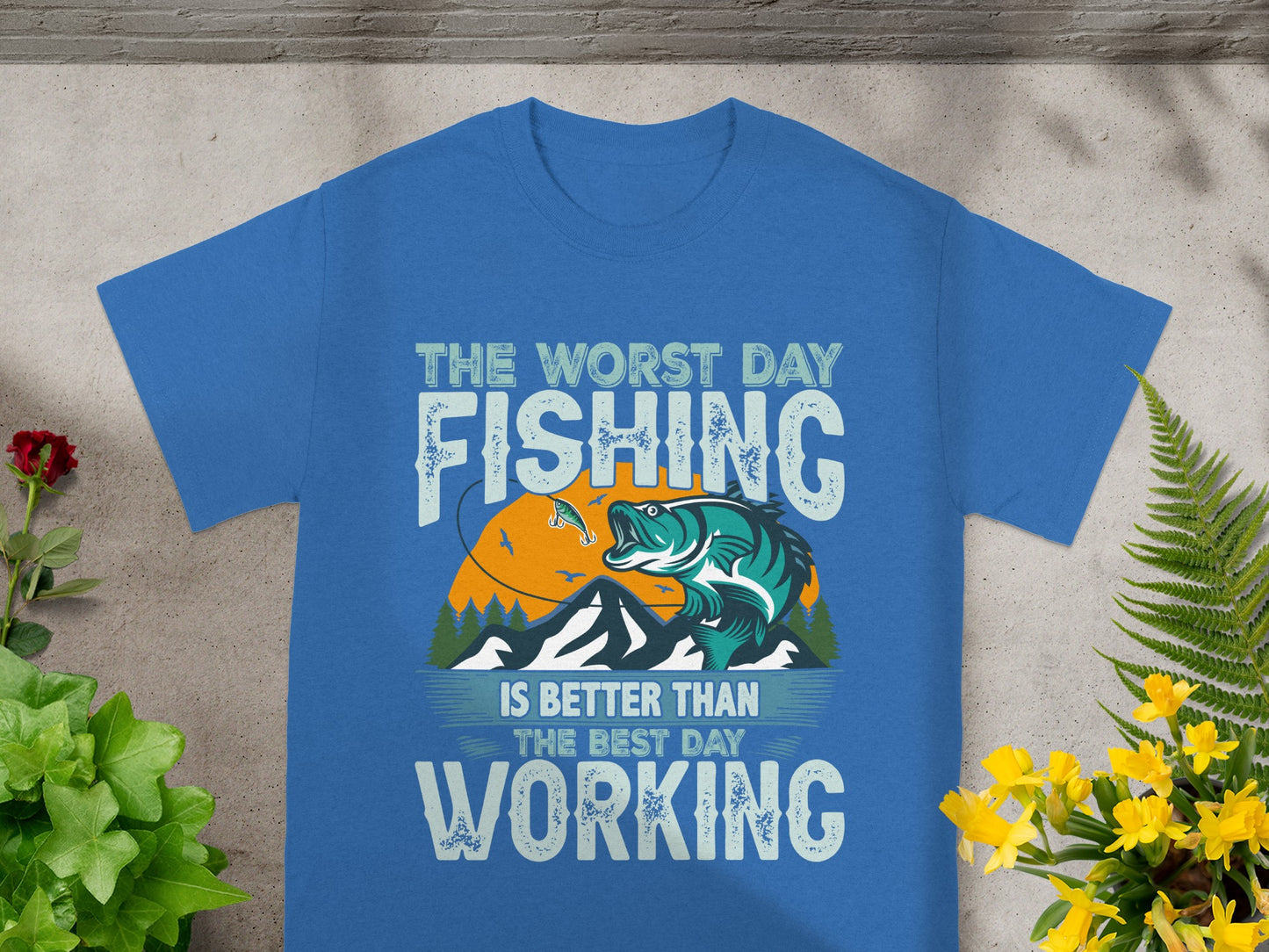 Blue t-shirt with text and graphic of a fish jumping for a lure.