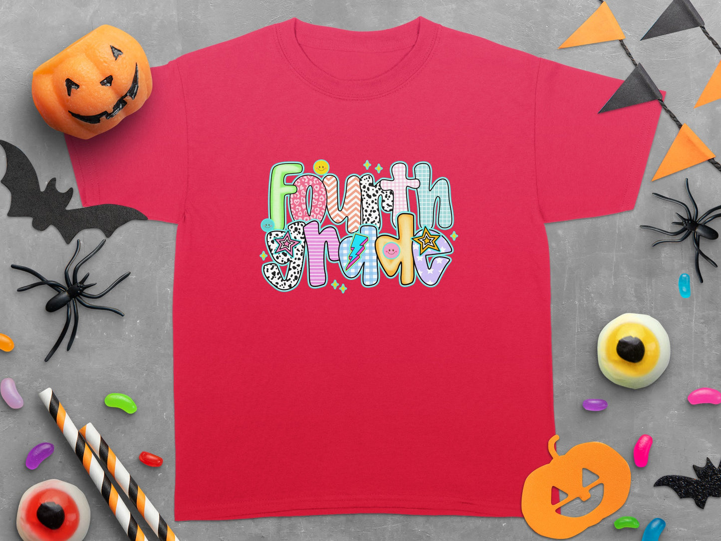 Red t-shirt featuring "Fourth Grade" text in colorful, patterned letters.