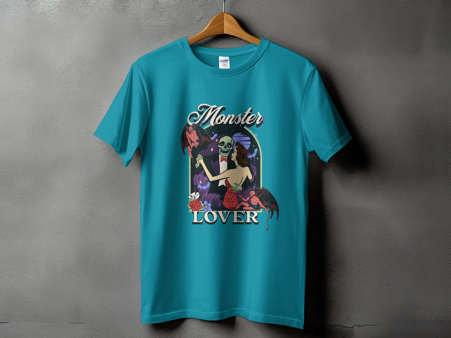 Teal t-shirt with "Monster Lover" text and a gothic-themed graphic.
