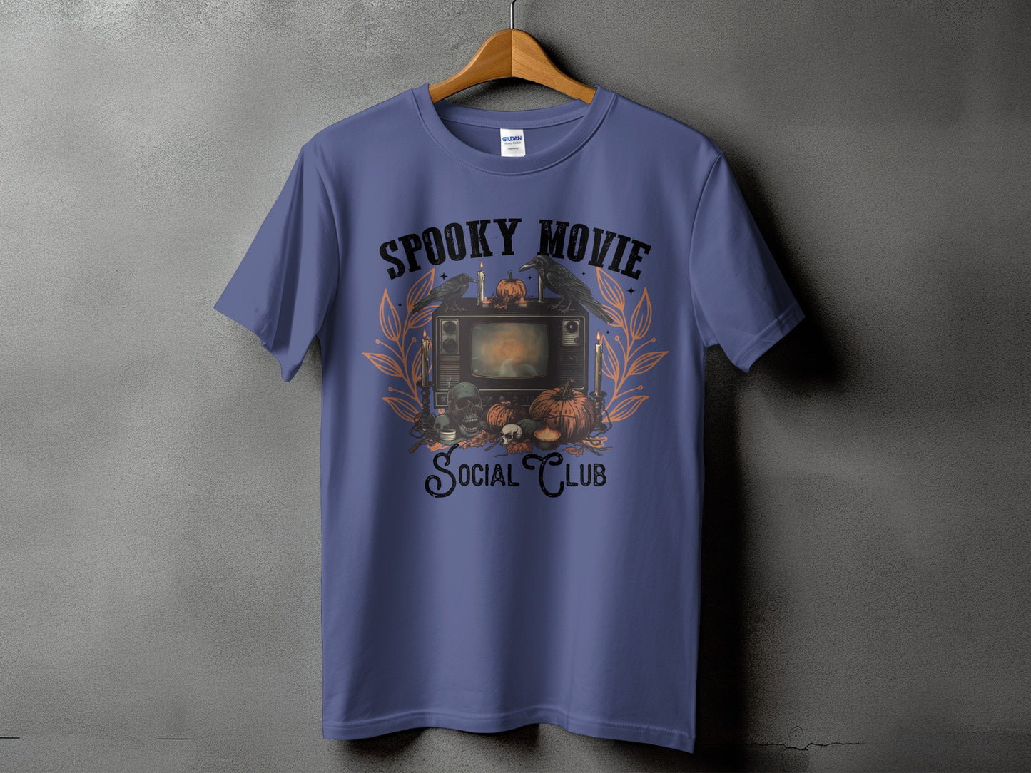 Purple t-shirt with "Spooky Movie Social Club" Halloween graphic.
