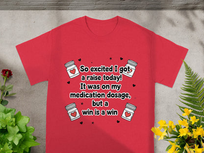 Red t-shirt with "So excited I got a raise today! It was on my medication dosage, but a win is a win"