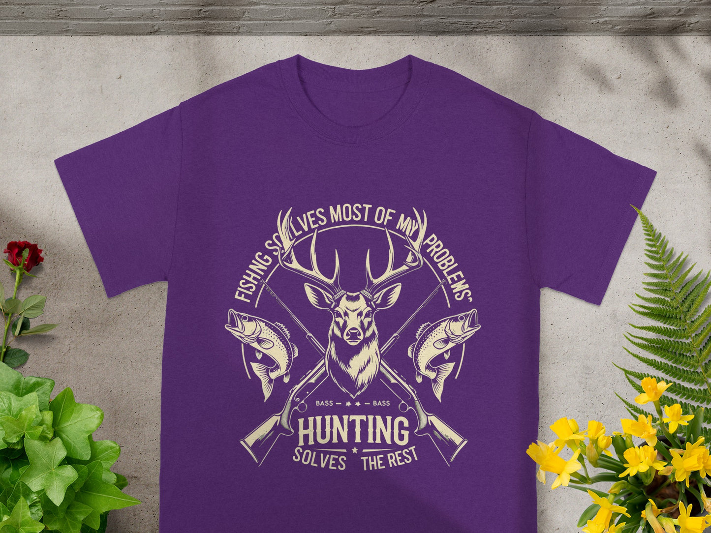 Purple t-shirt with deer, fish, guns, and text: "Fishing solves most of my problems. Hunting solves the rest".
