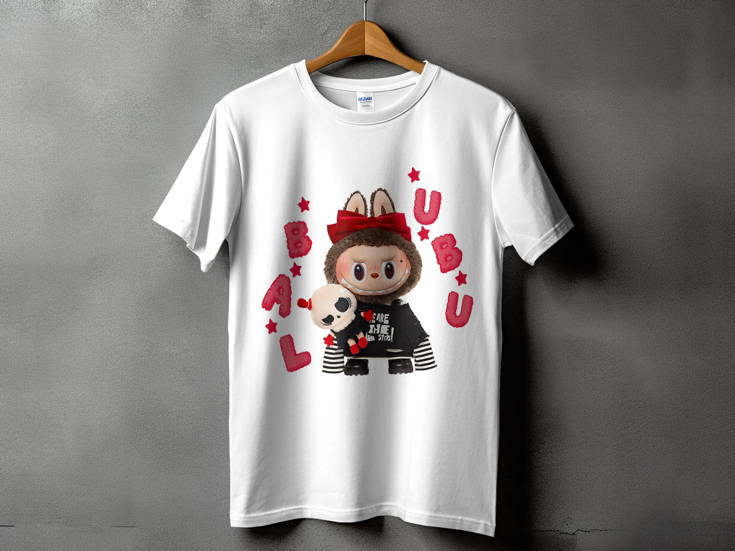 White t-shirt with a cartoon character holding a skull, surrounded by red letters and stars.