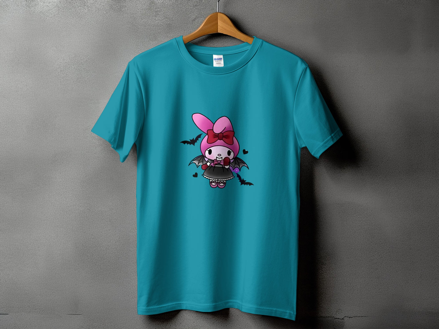 Teal t-shirt with a cute gothic bunny character graphic and bats.