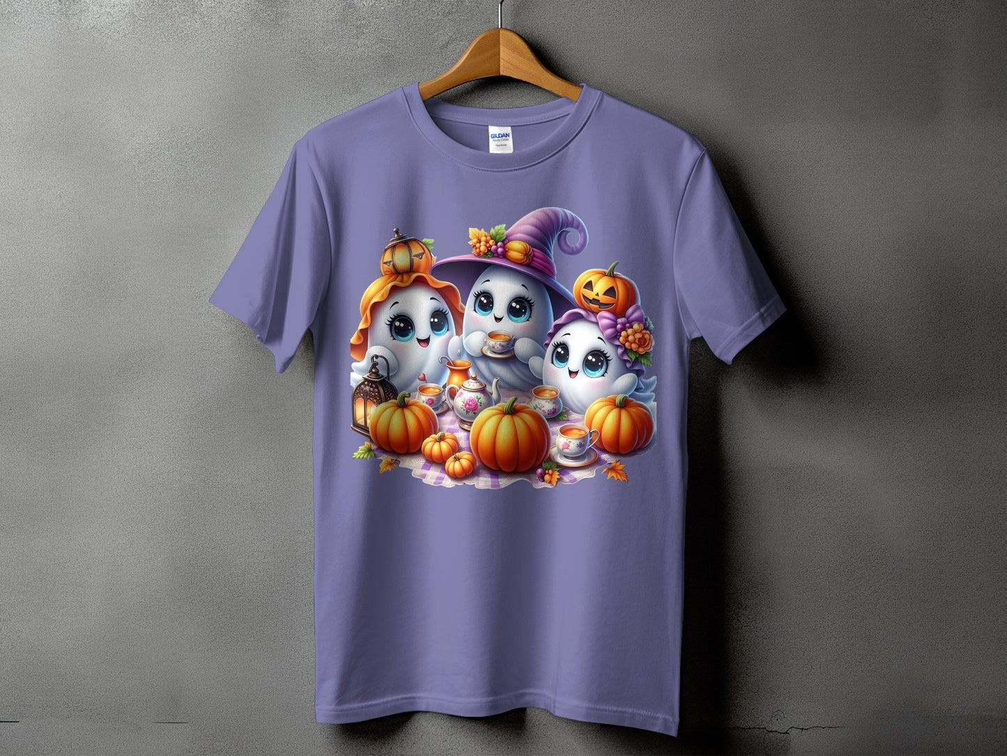 Three cute ghosts enjoy tea with pumpkins and a lantern on a purple t-shirt.