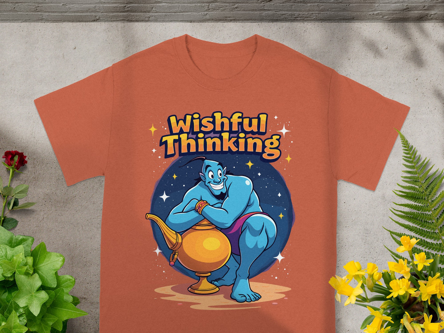 Orange t-shirt with blue genie holding lamp, text "Wishful Thinking."