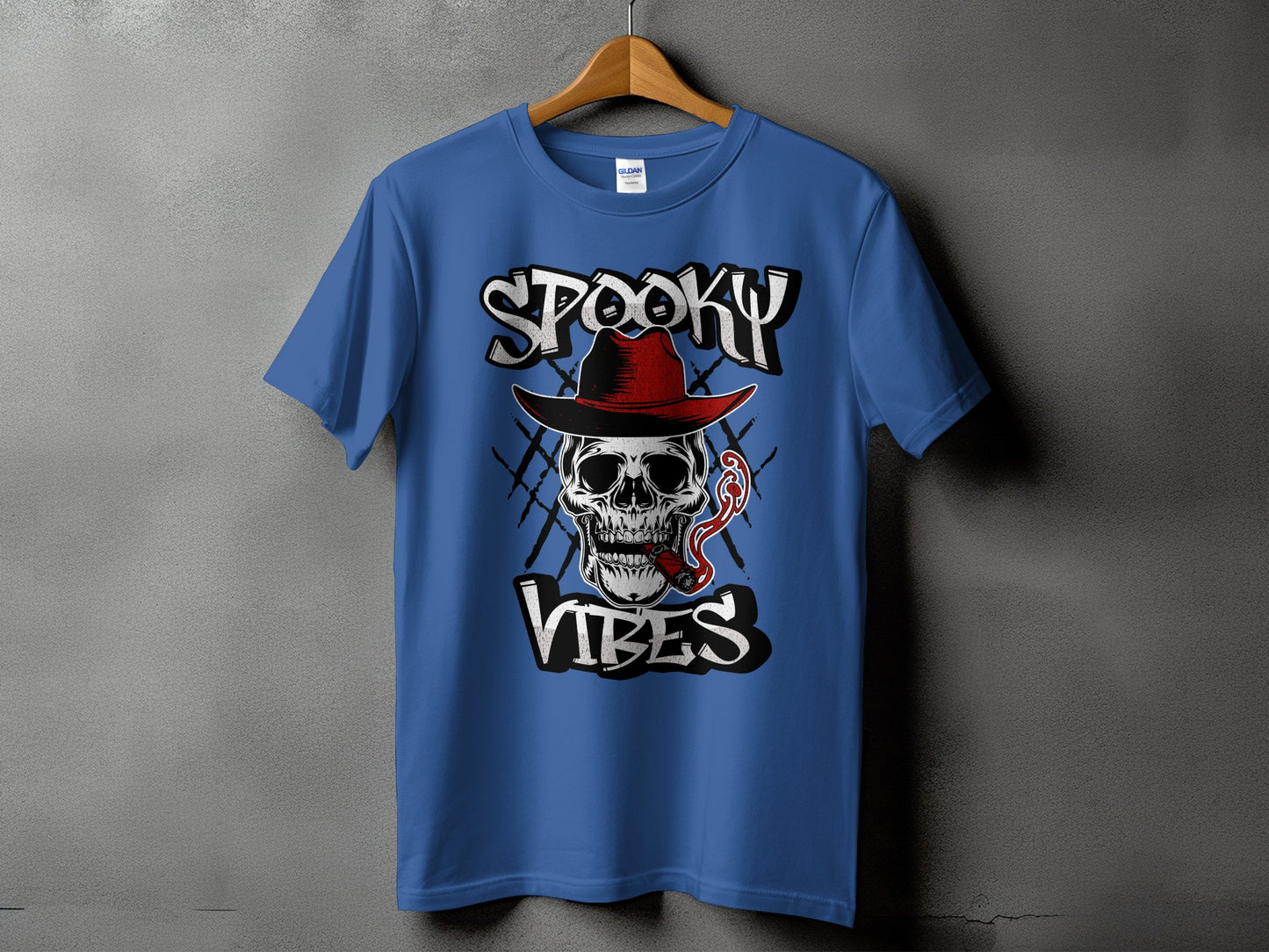Blue t-shirt with graphic of skull smoking cigar, text "SPOOKY VIBES".