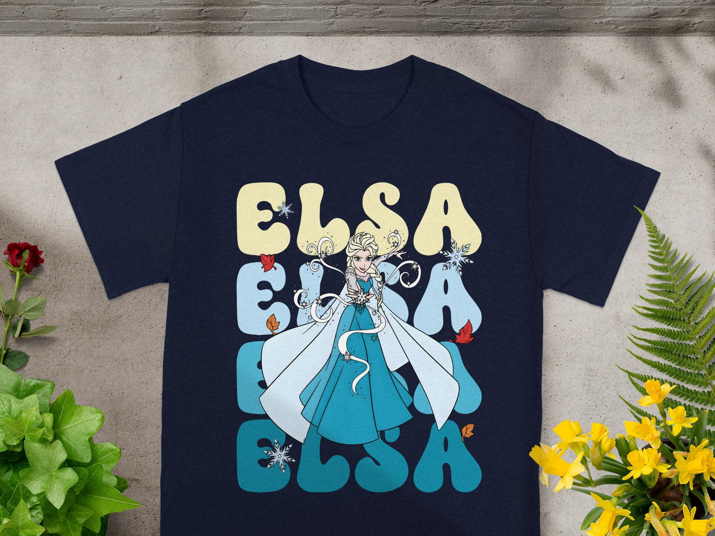 Navy t-shirt with Elsa from Frozen text and character graphic.