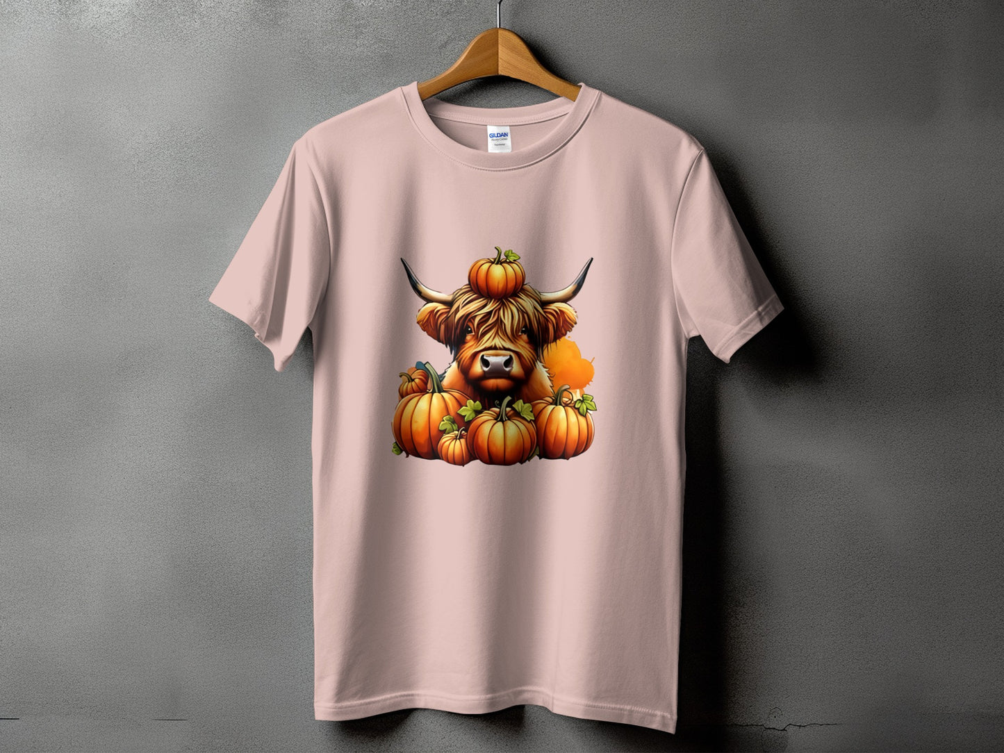 Highland cow wearing pumpkins on head surrounded by pumpkins.