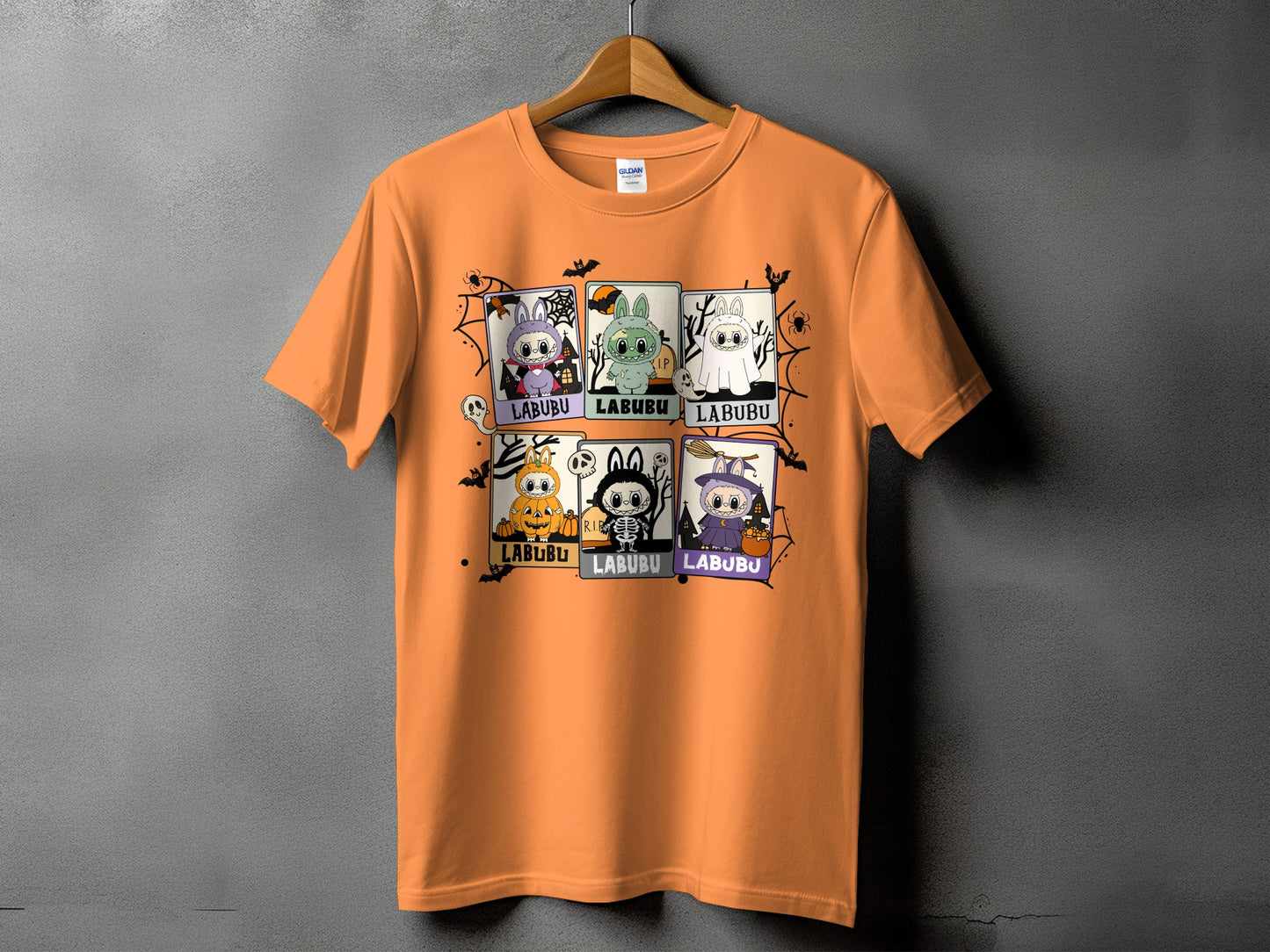 Orange t-shirt with six Halloween-themed "LABUBU" character illustrations.