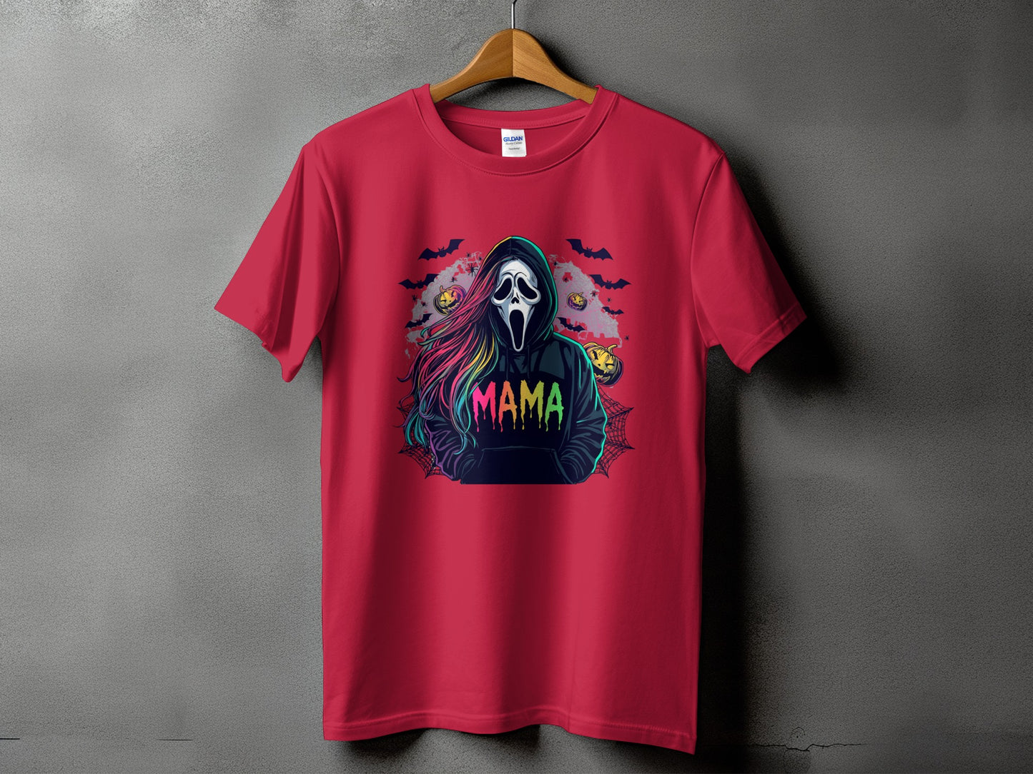 Red t-shirt with Halloween graphic featuring ghost mask, bats, pumpkins, and "MAMA" text.