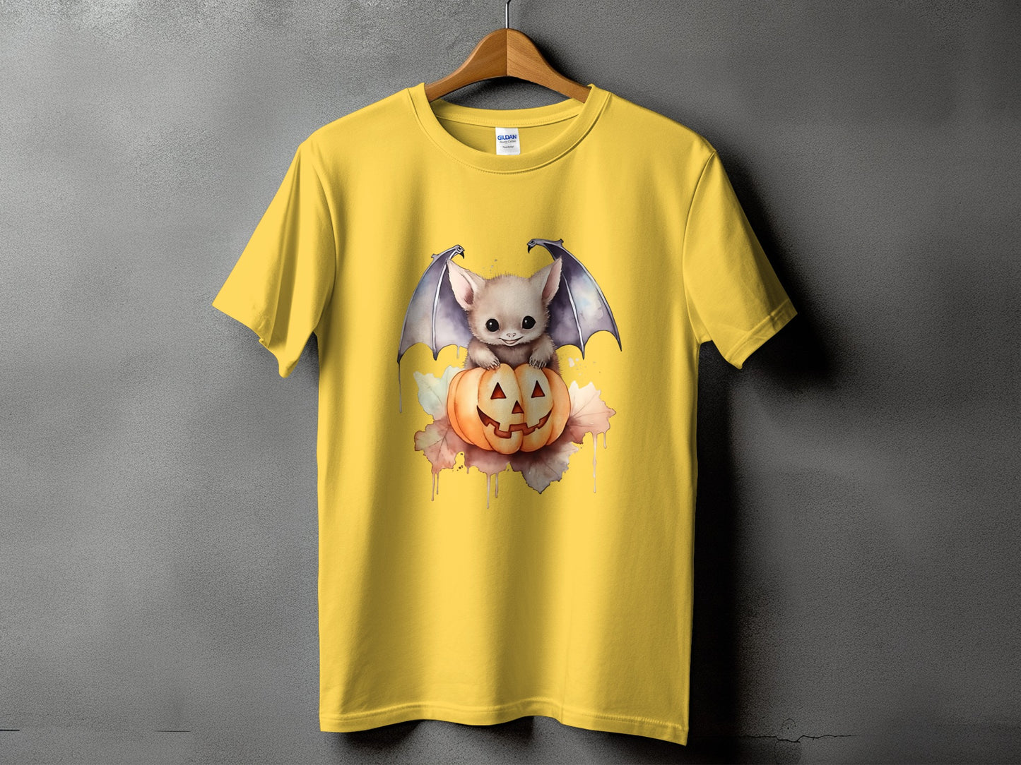 Yellow t-shirt with a cute bat on a Halloween pumpkin design.