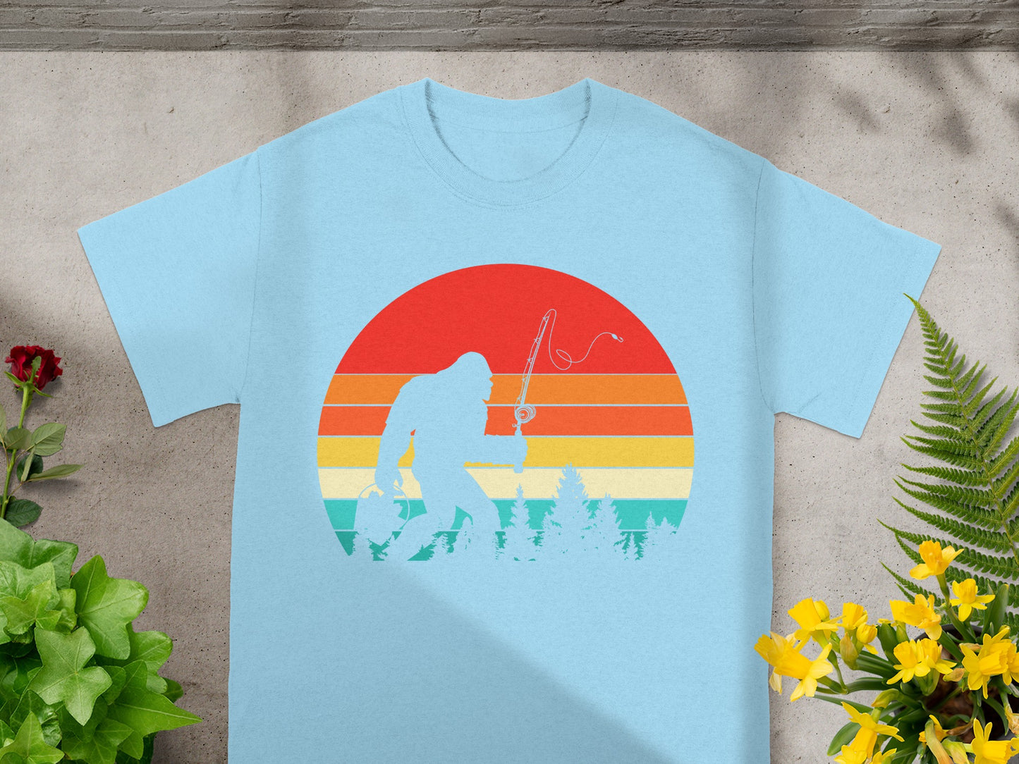 Bigfoot fishing silhouette against a striped retro sunset and pine trees.