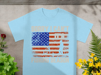 Light blue t-shirt with distressed American flag and fisherman graphic.