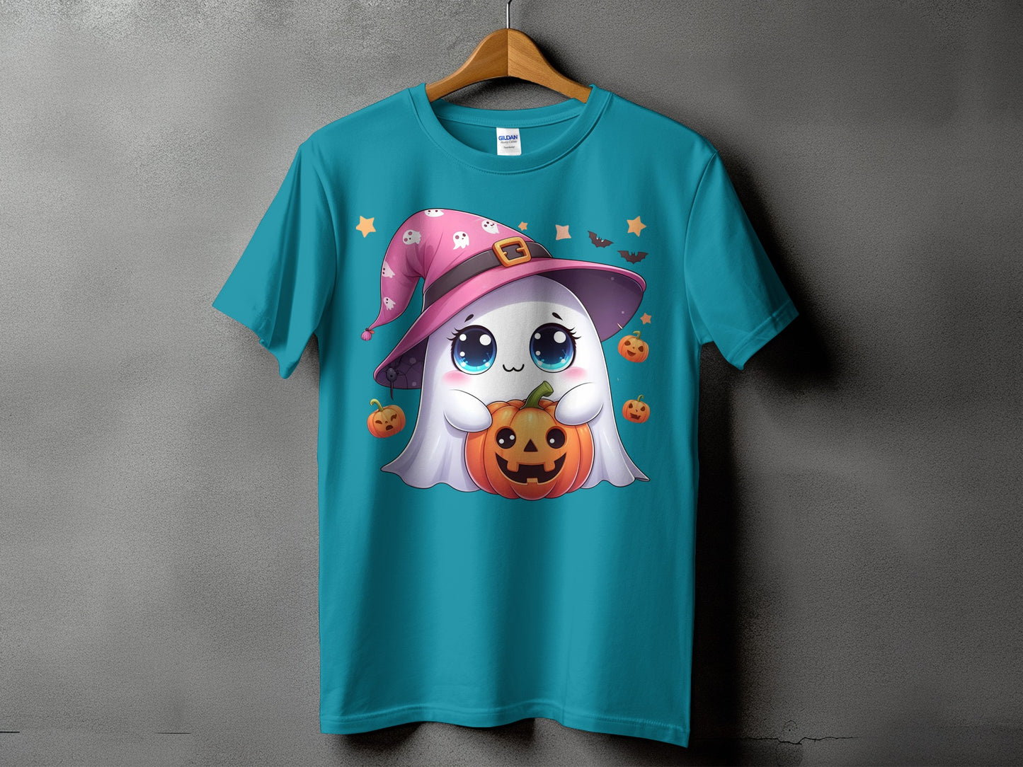 Teal t-shirt with a cute ghost wearing a witch hat holding a pumpkin.
