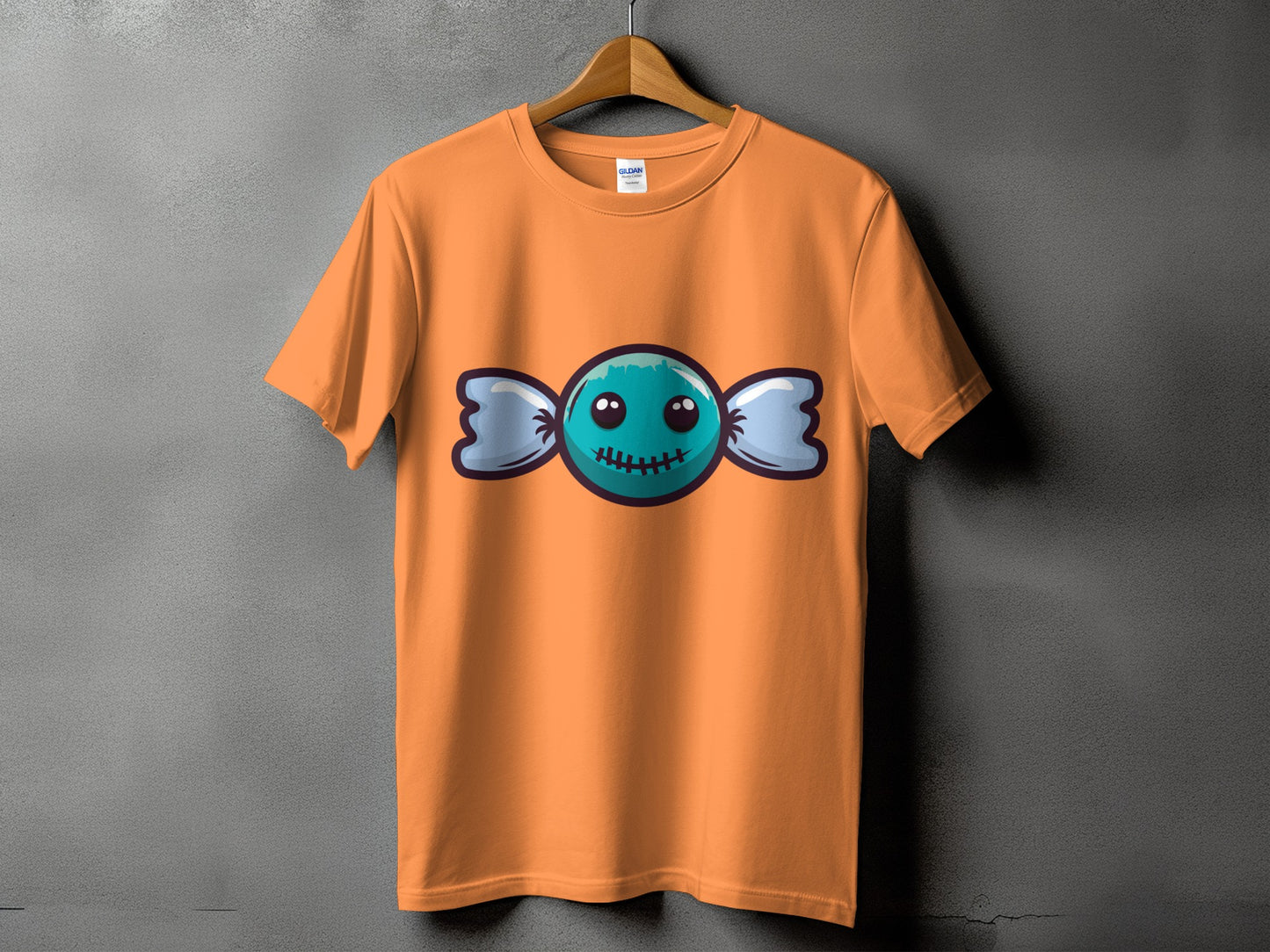 Orange t-shirt with a blue candy graphic with a stitched mouth.