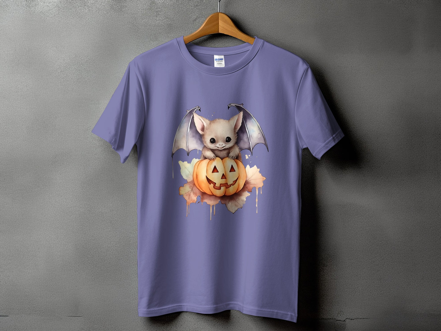 Purple t-shirt with a cute bat and jack-o'-lantern Halloween graphic.