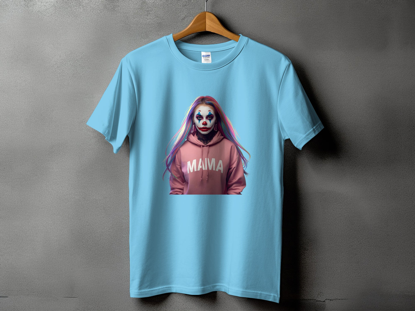 Light blue t-shirt featuring a clown with "MAMA" text on a pink hoodie.