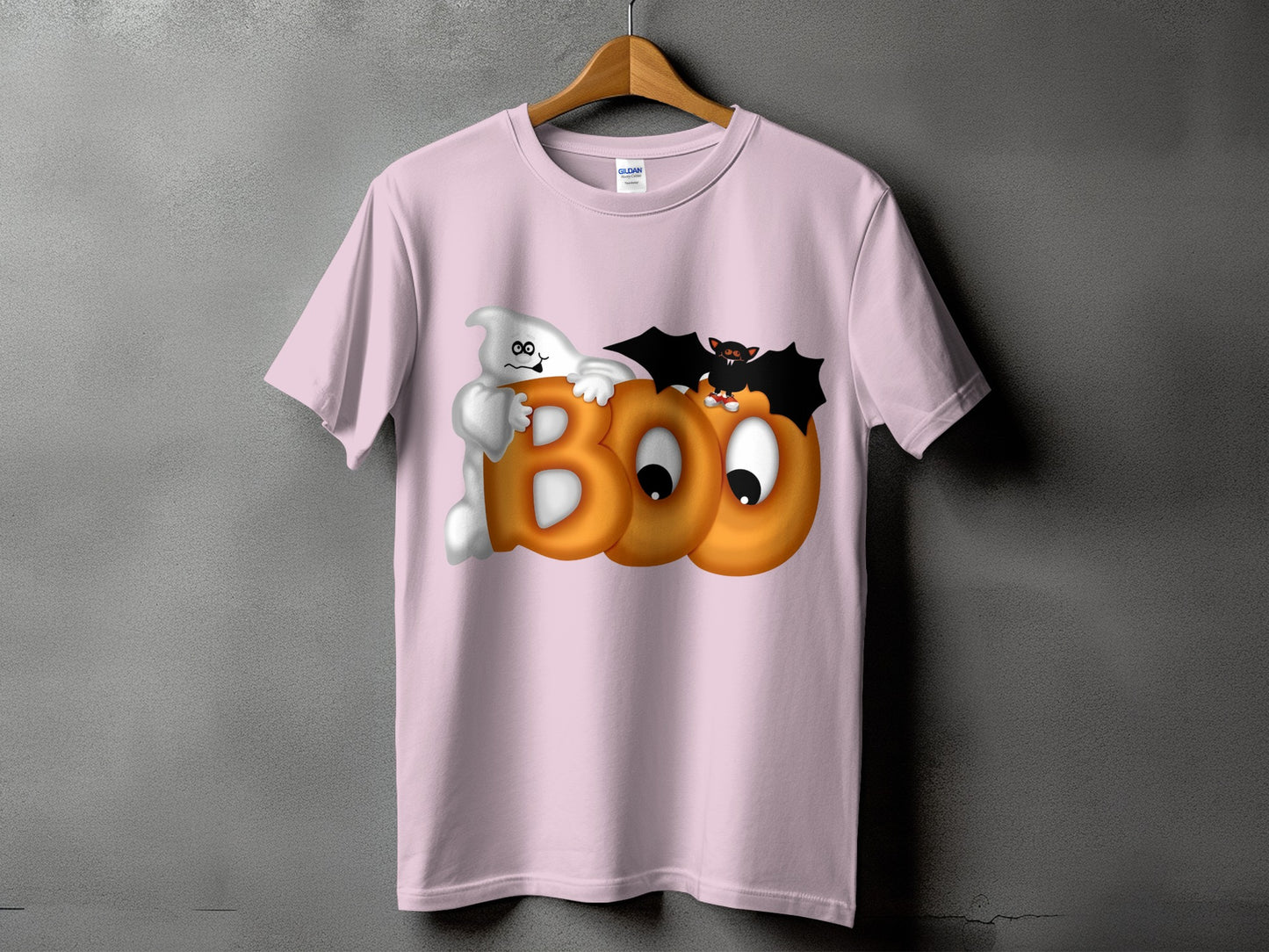 Pink t-shirt with ghost, bat, and pumpkin "BOO" Halloween graphic.