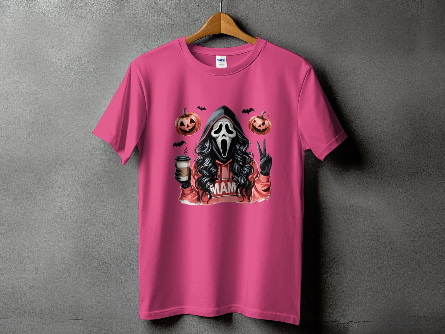 Ghostface with pumpkins, coffee, and peace sign, on a pink t-shirt.