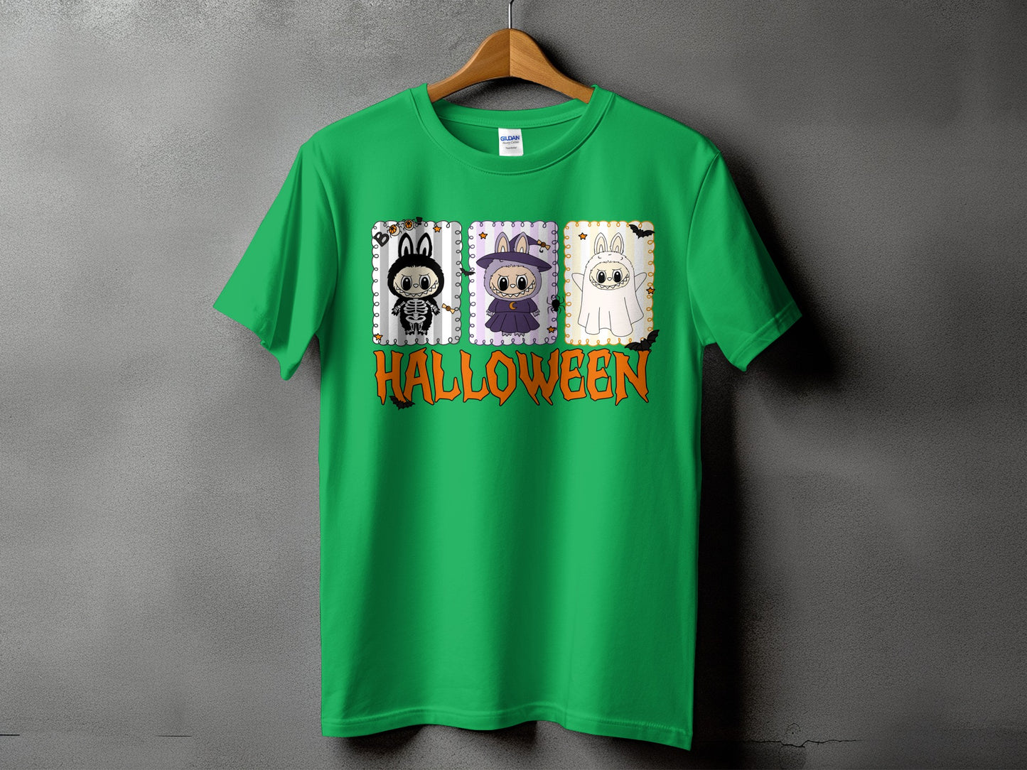 Green t-shirt with three cartoon Halloween characters and the word HALLOWEEN.